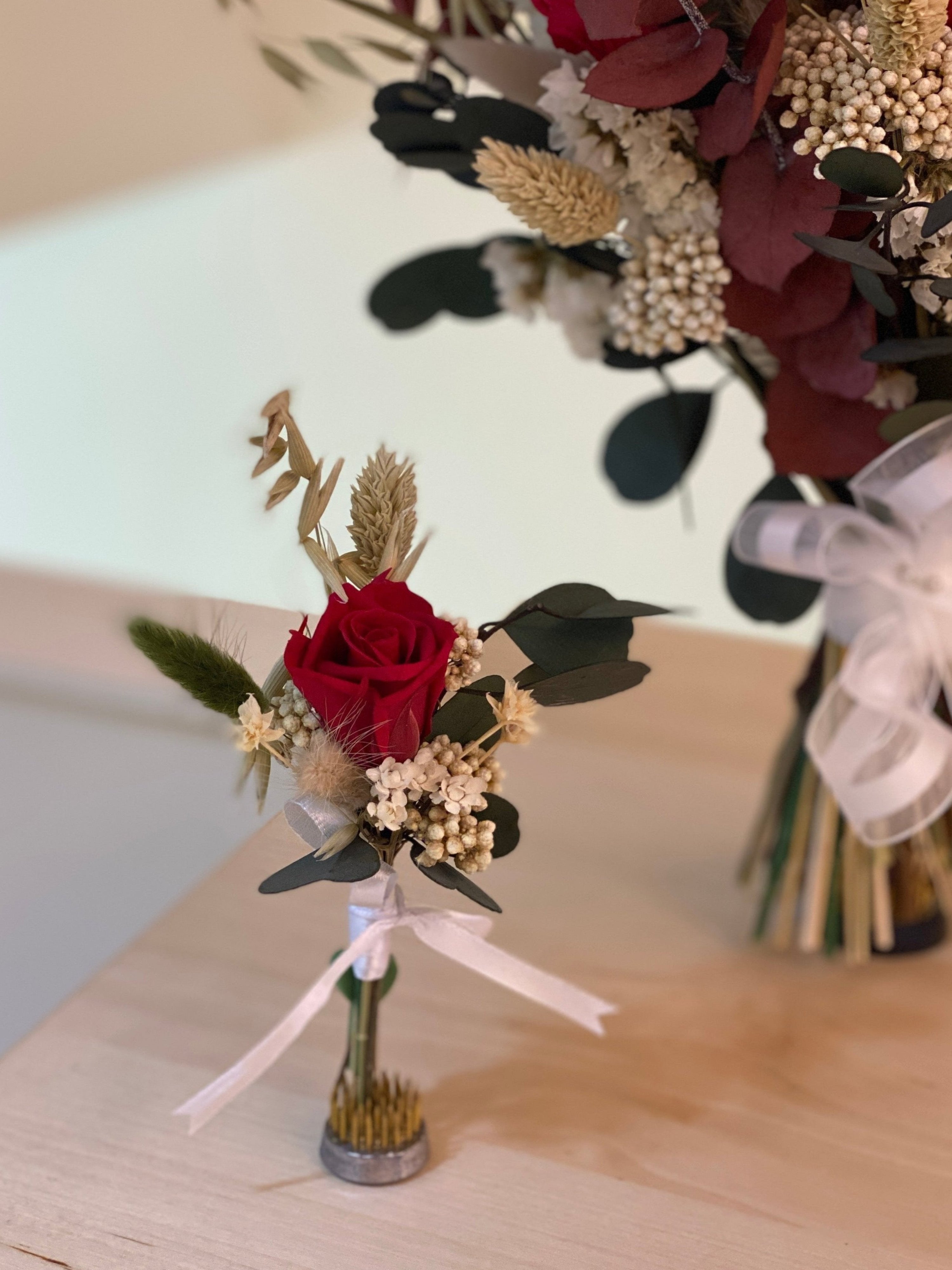 Custom Groom's Boutonnière, matching to bridal bouquet, made with preserved flowers crafted by Eden's Ground.