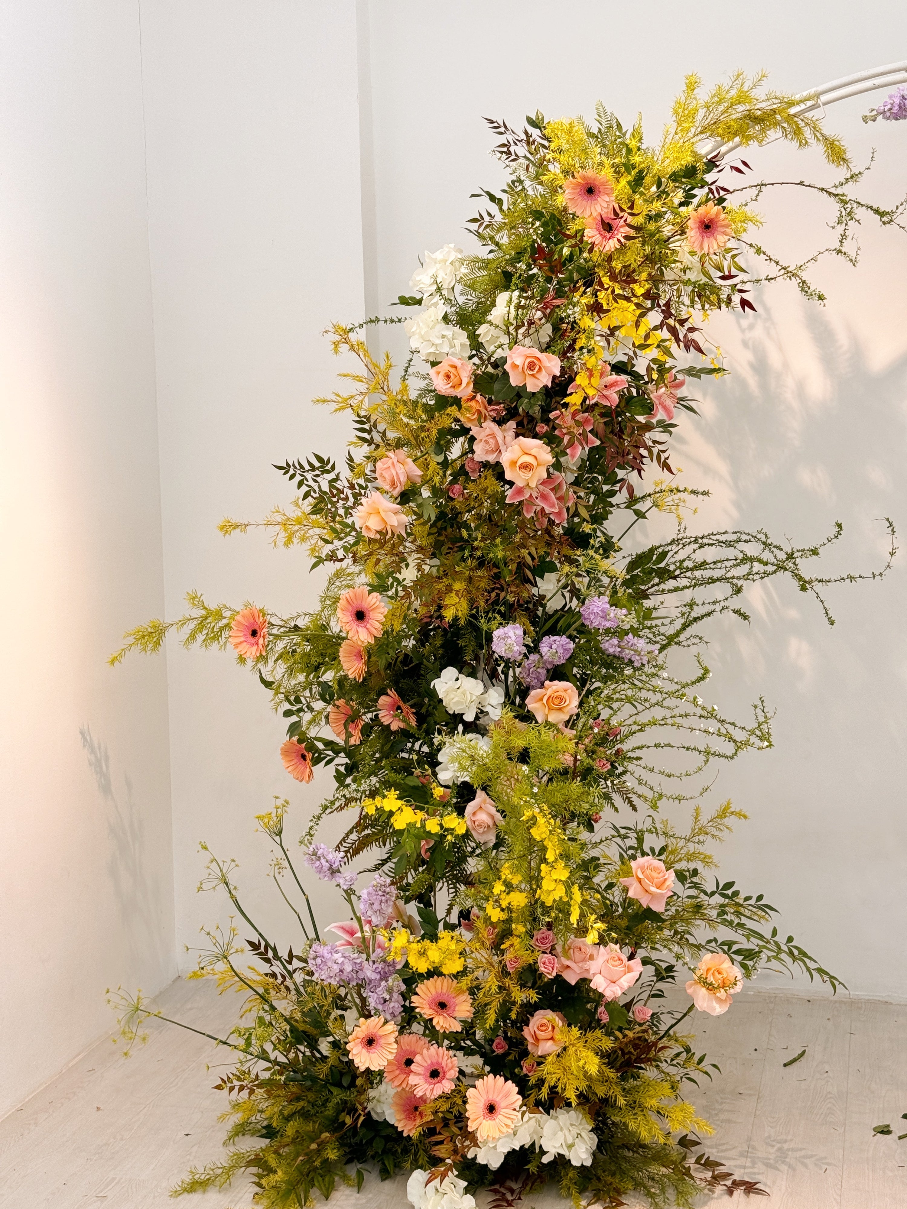 Wedding Floral Deconstructed Arch designed to complement your wedding theme and elevate your venue. Thoughtfully crafted with carefully selected blooms, this arch can frame your entrance, enhance your stage décor, or serve as a beautiful photo backdrop for guests and cherished moments. Crafted by Eden’s Ground, a floral design boutique.