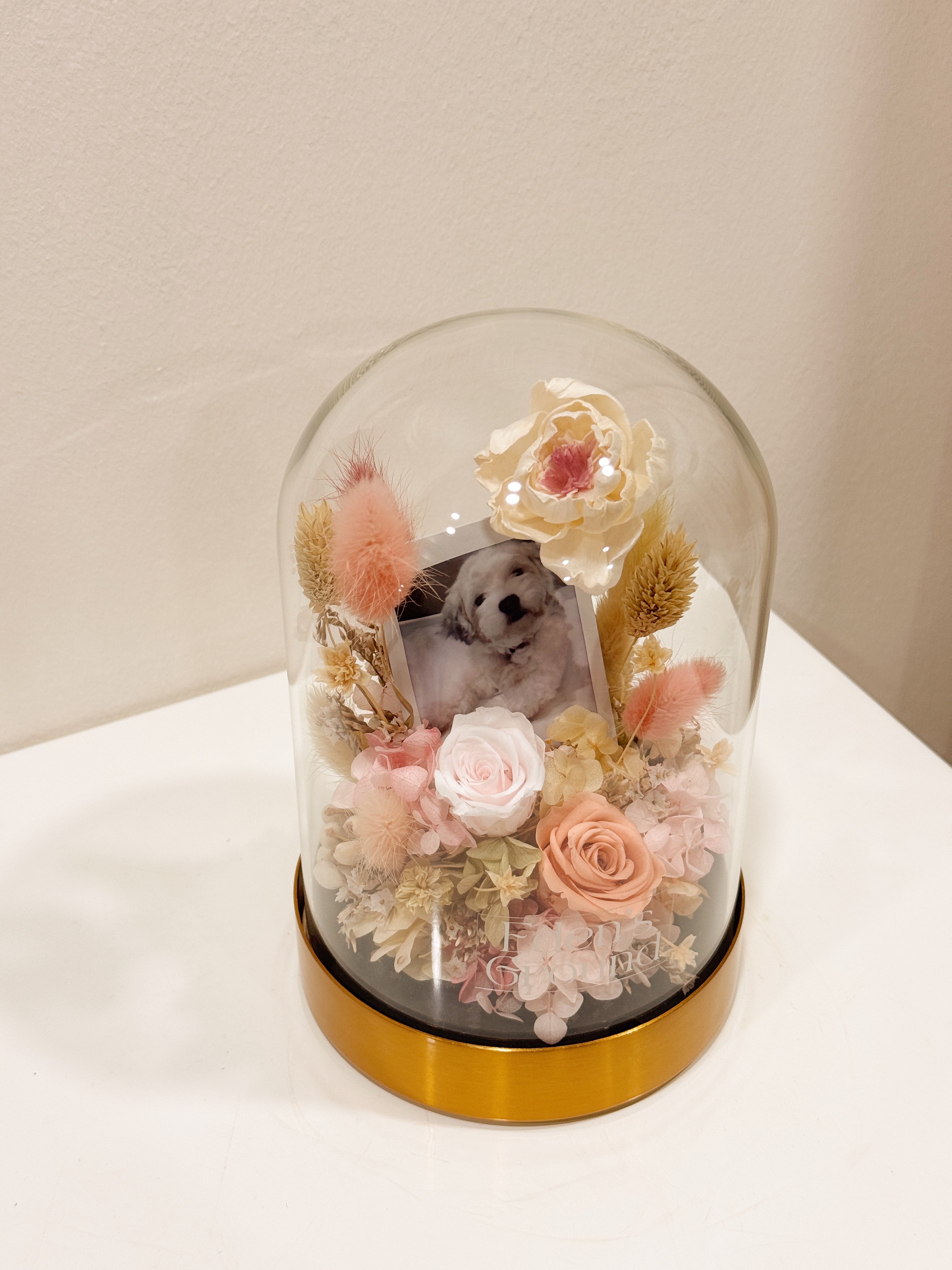 Preserved flower dome with your own photo as a memory capsule, styled in a lighted glass dome on a gold base. Crafted by Eden's Ground, a floral design boutique.