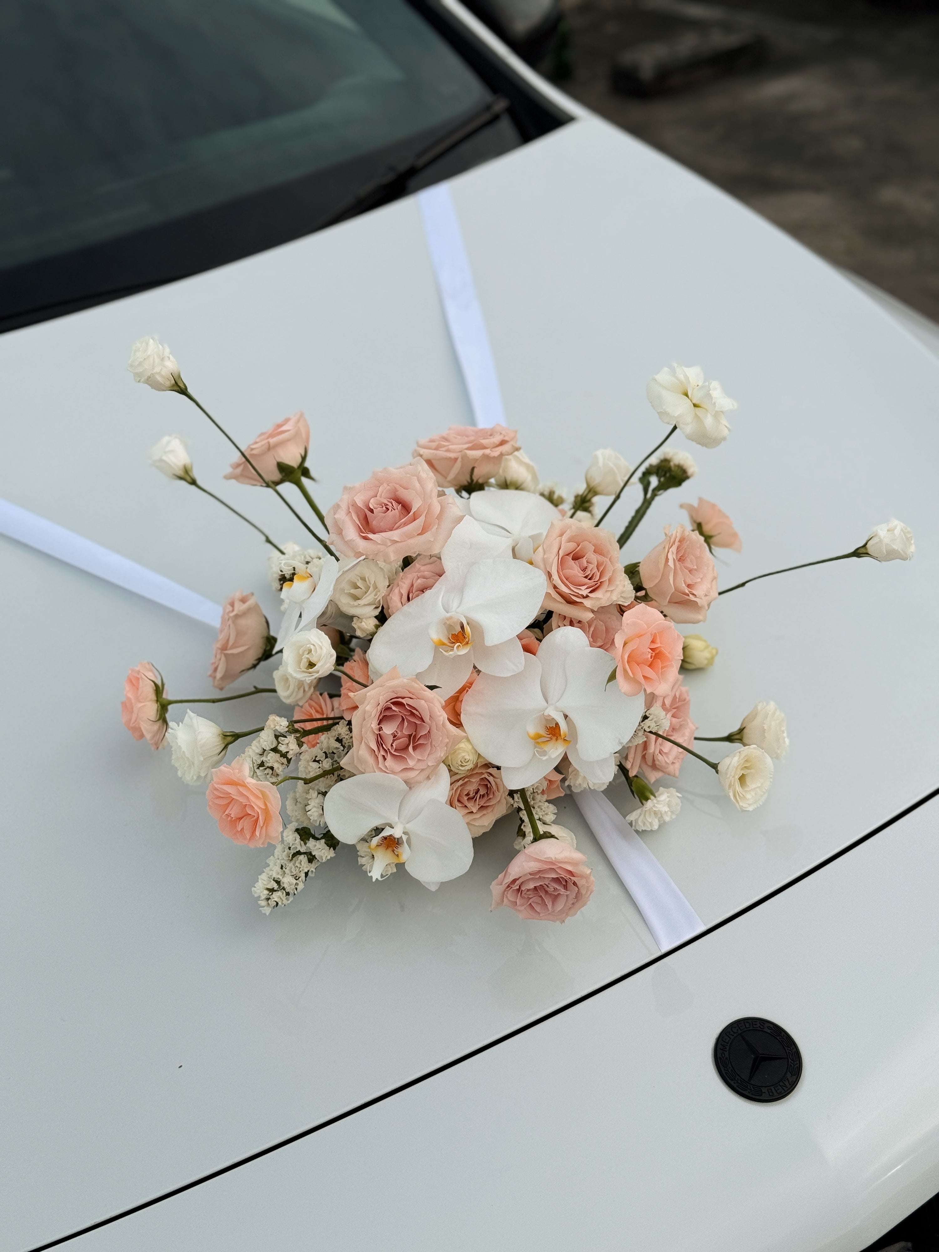 Wedding bridal car decor, craffted with fresh flowers by Eden's Ground, a floral design boutique.