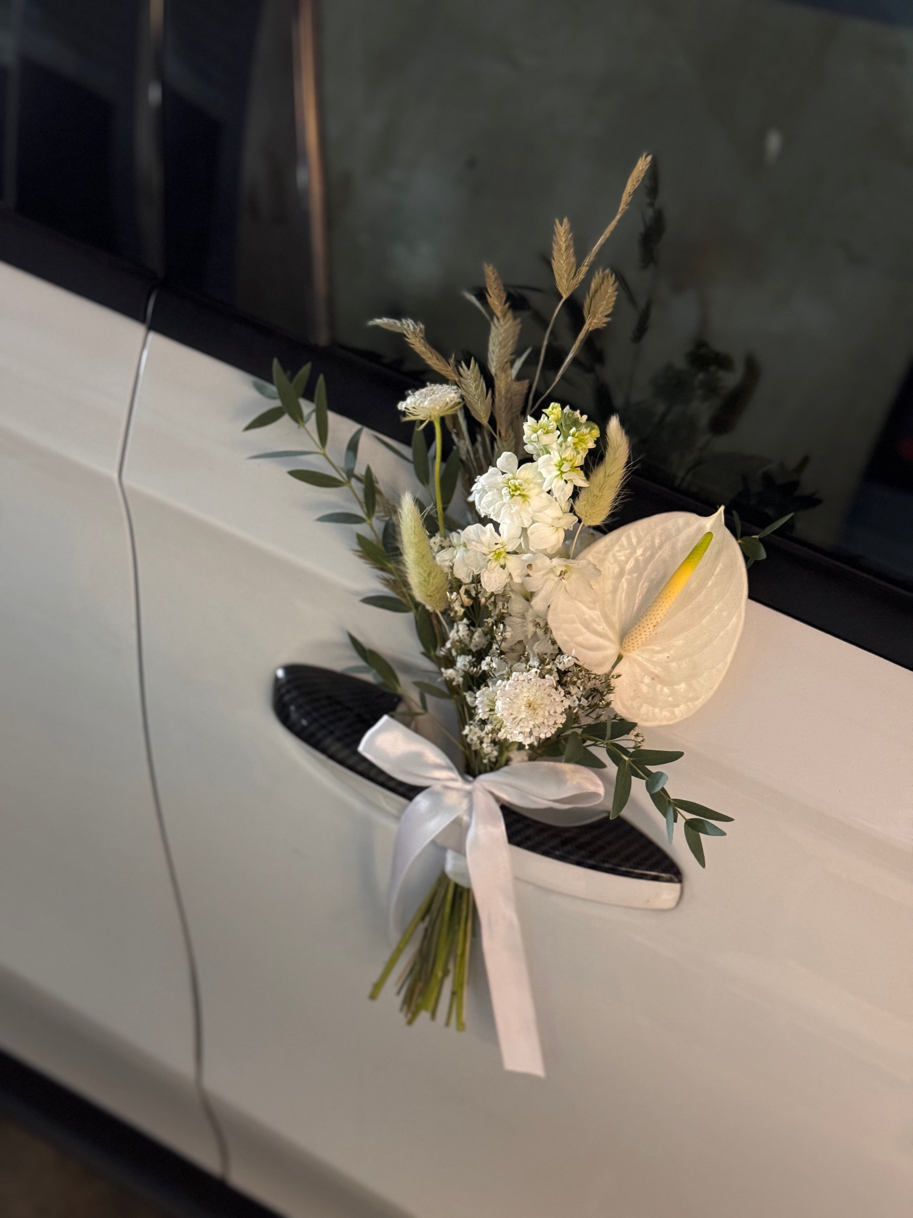Wedding bridal car decor, craffted with fresh flowers by Eden's Ground, a floral design boutique.