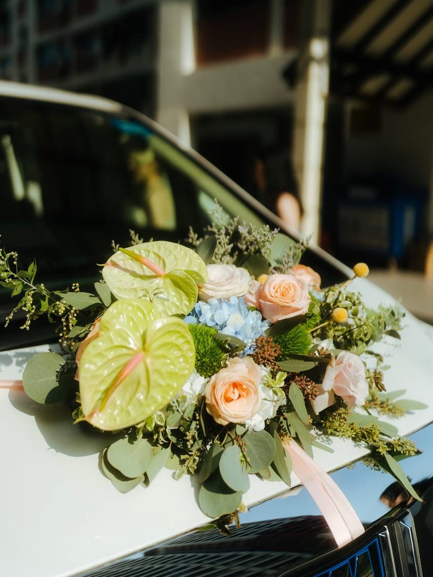 Wedding bridal car decor, craffted with fresh flowers by Eden's Ground, a floral design boutique.