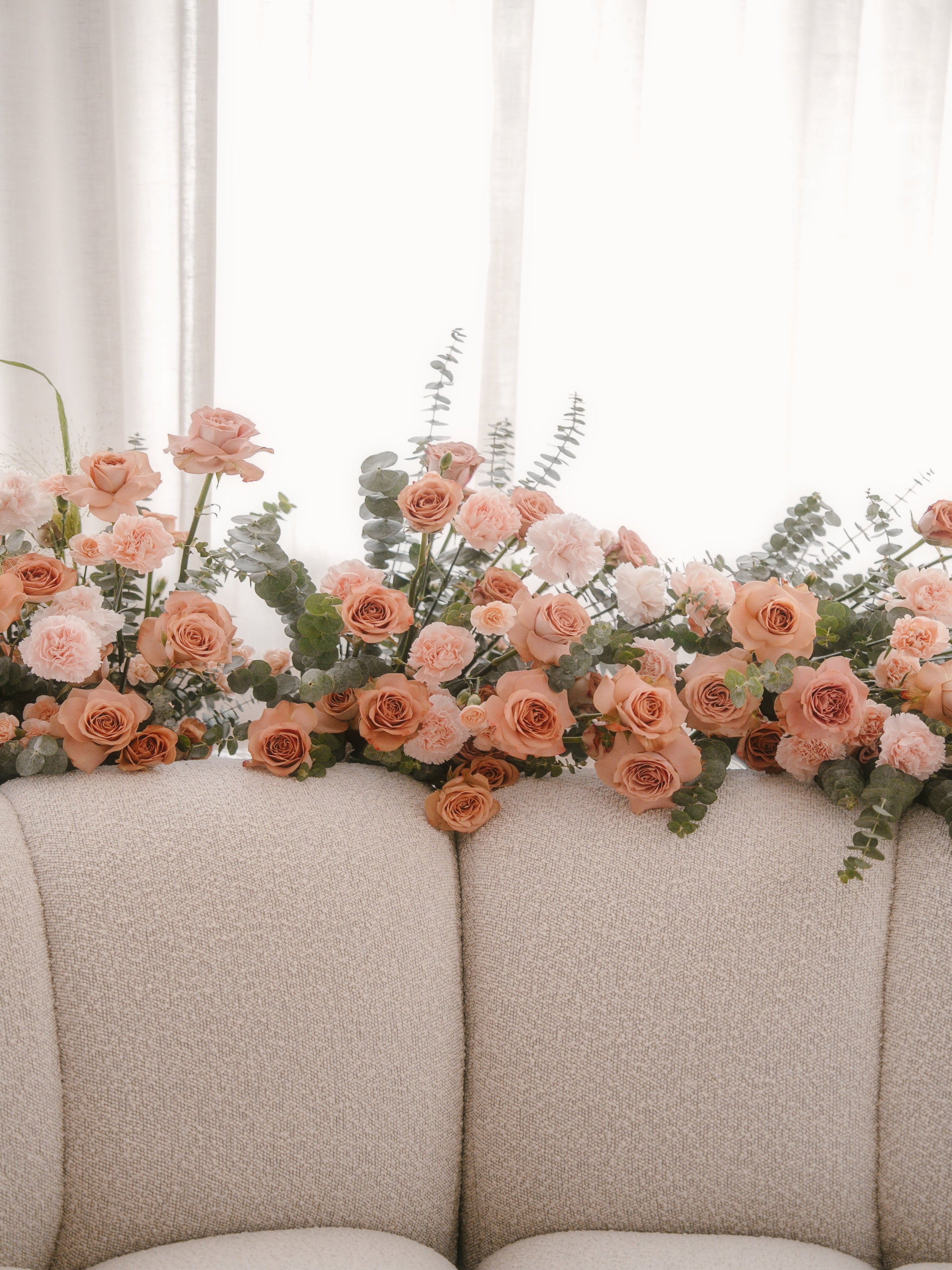 Ground floral hedges or set up on a pedestal, made thoughtfully to complement your wedding theme with carefully selected blooms — to adorn your venue as you walk down the aisle, create an Instagram-worthy photo wall and backdrop, or elegantly define spaces at your wedding. Made by Eden's Ground, a floral design boutique in Singapore.