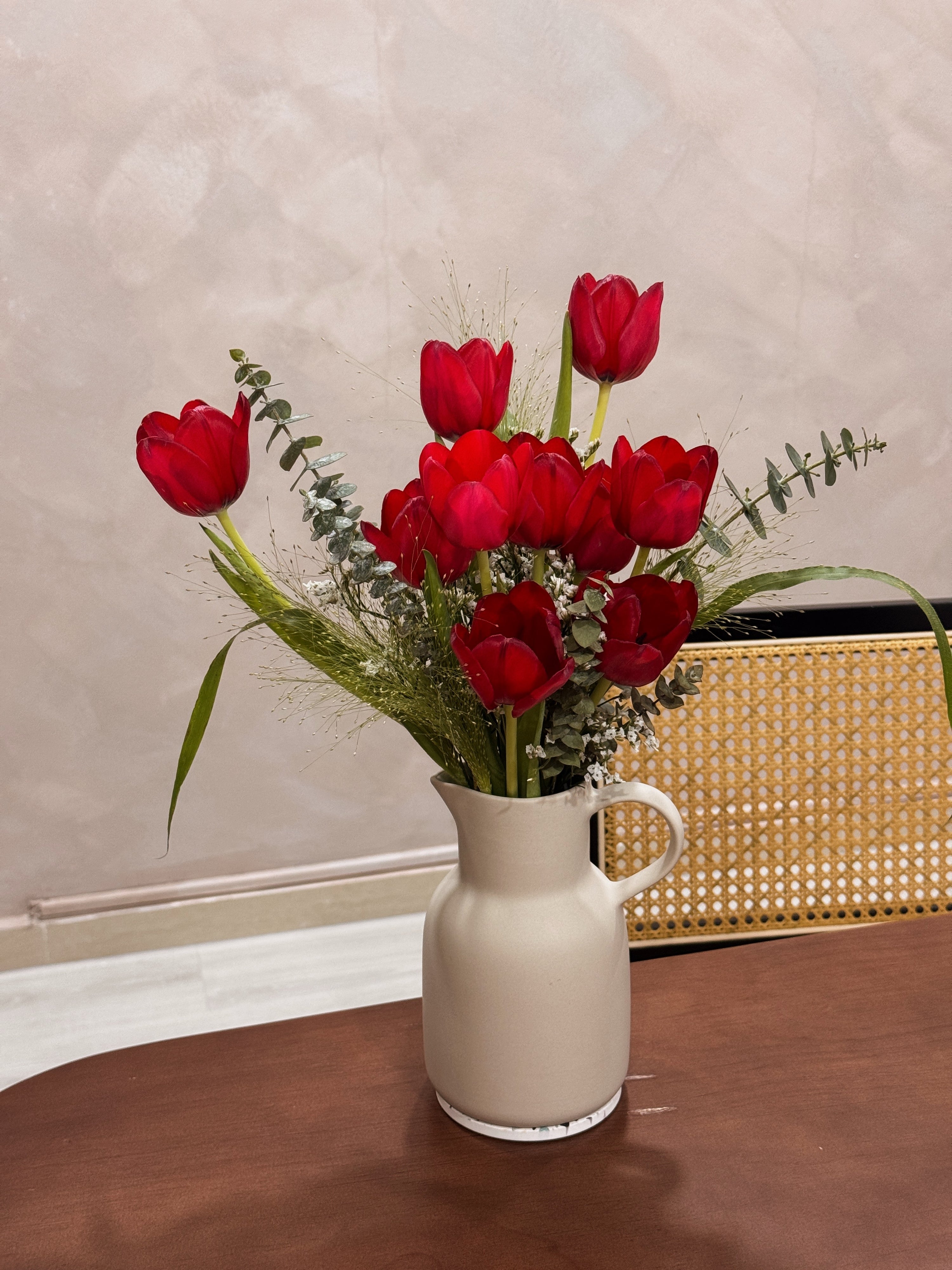 Sweetest Love bouquet featuring vibrant red tulips with lots of textural foliage such as eucalyptus, wrapped in brown honeycomb and kraft paper crafted by Eden’s Ground, a floral design boutique based in Singapore.