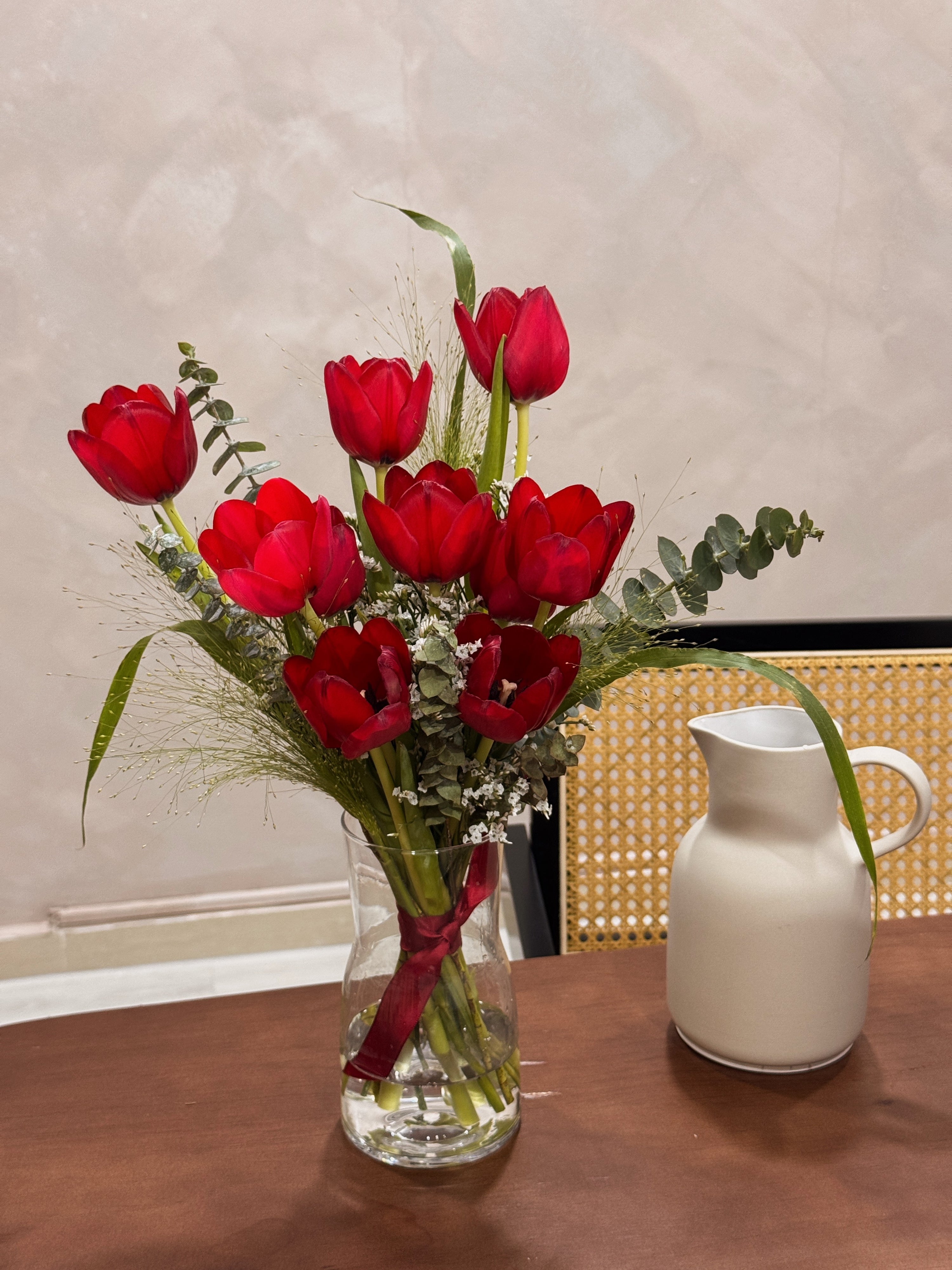 Sweetest Love bouquet featuring vibrant red tulips with lots of textural foliage such as eucalyptus, wrapped in brown honeycomb and kraft paper crafted by Eden’s Ground, a floral design boutique based in Singapore.