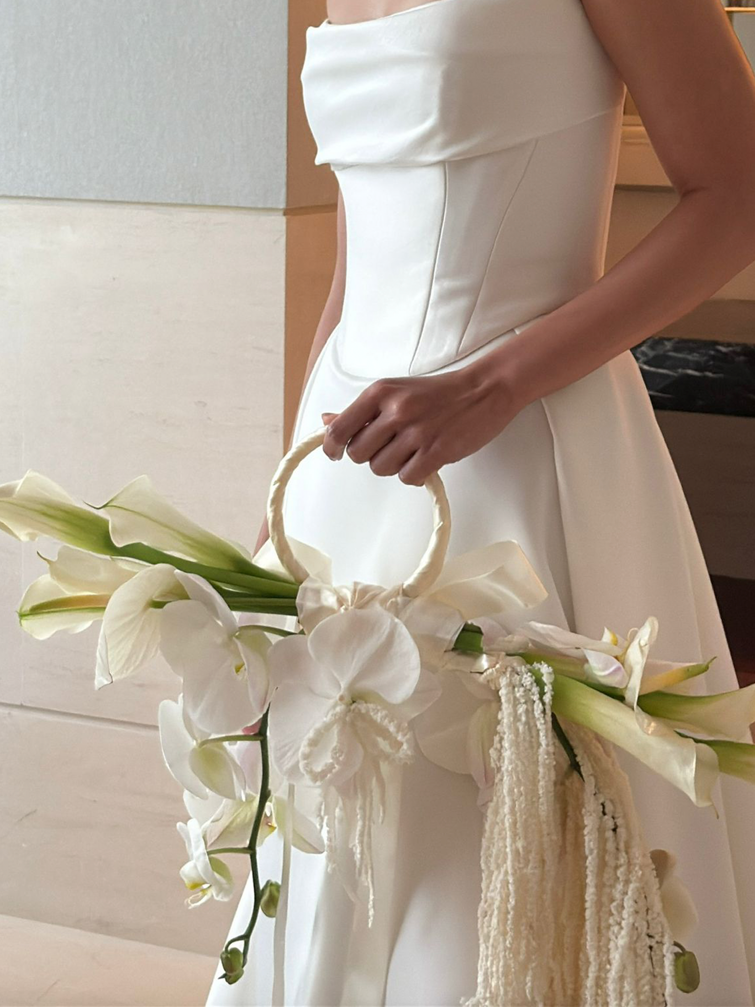 Top 2025 Bridal Bouquet and Wedding Trend. Custom Bridal Bouquet Bag made with white Calla Lilies and Orchid, crafted by Eden's Ground.