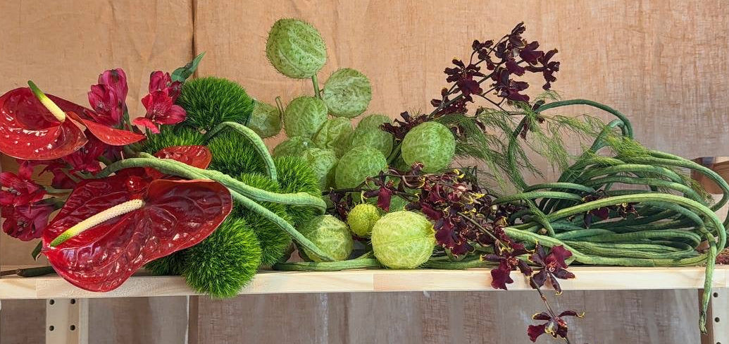 Bespoke Venue styling of flowers and unique materials like long beans, crafted by Eden's Ground