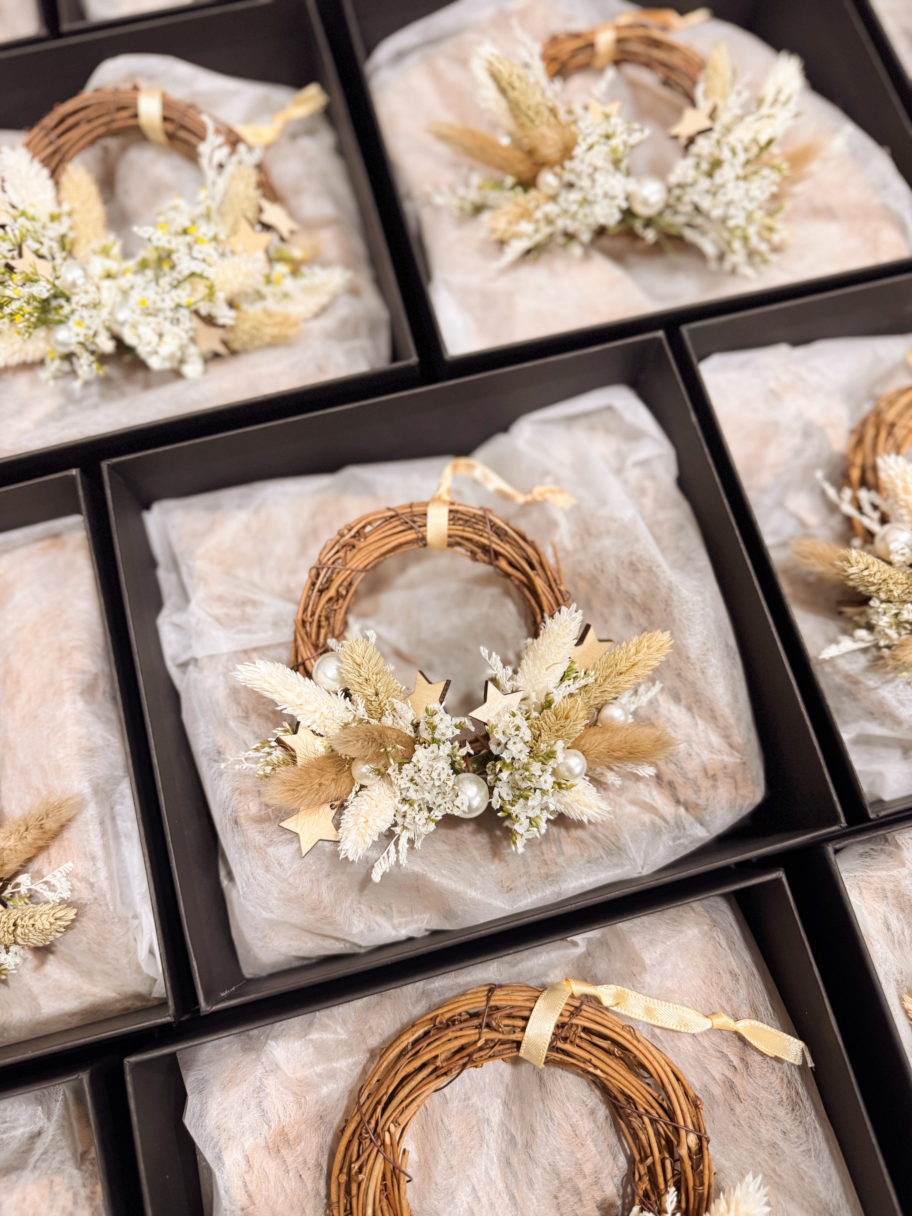 Mini Christmas Wreath decorated with pearls and stars for luxury brand like Chanel and Dior in Singapore for festive gifting in Singapore, by Eden's Ground, a floral design studio.