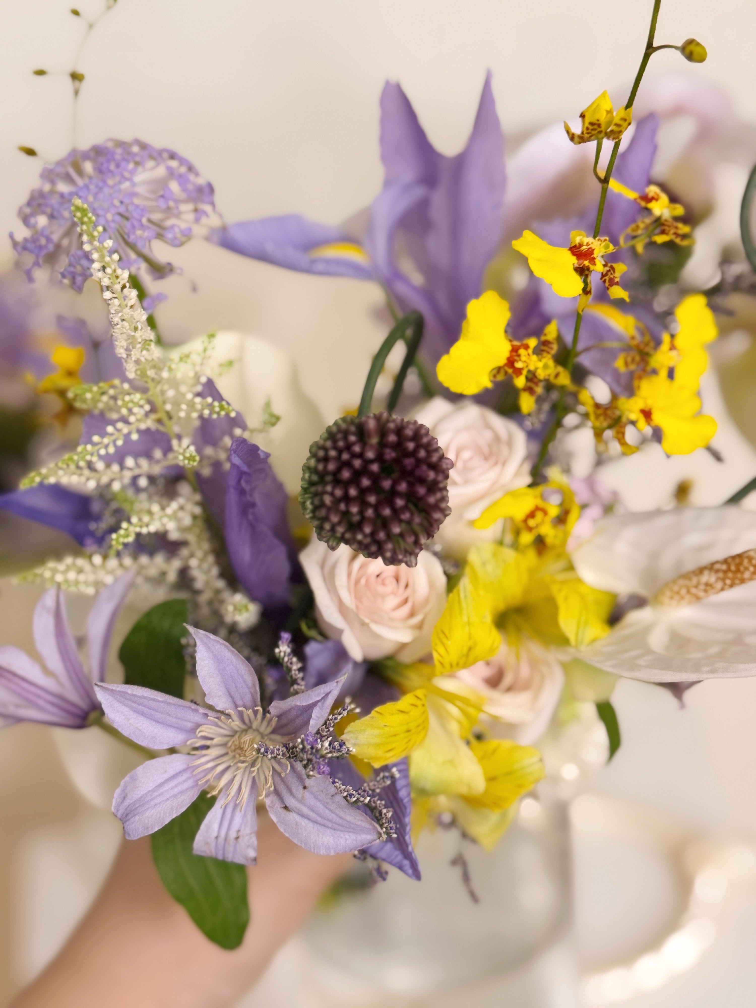 2026 Bridal Bouquet and Wedding Trend. Custom Bridal Bouquet Bag made with white Calla Lilies and Orchid, crafted by Eden's Ground.