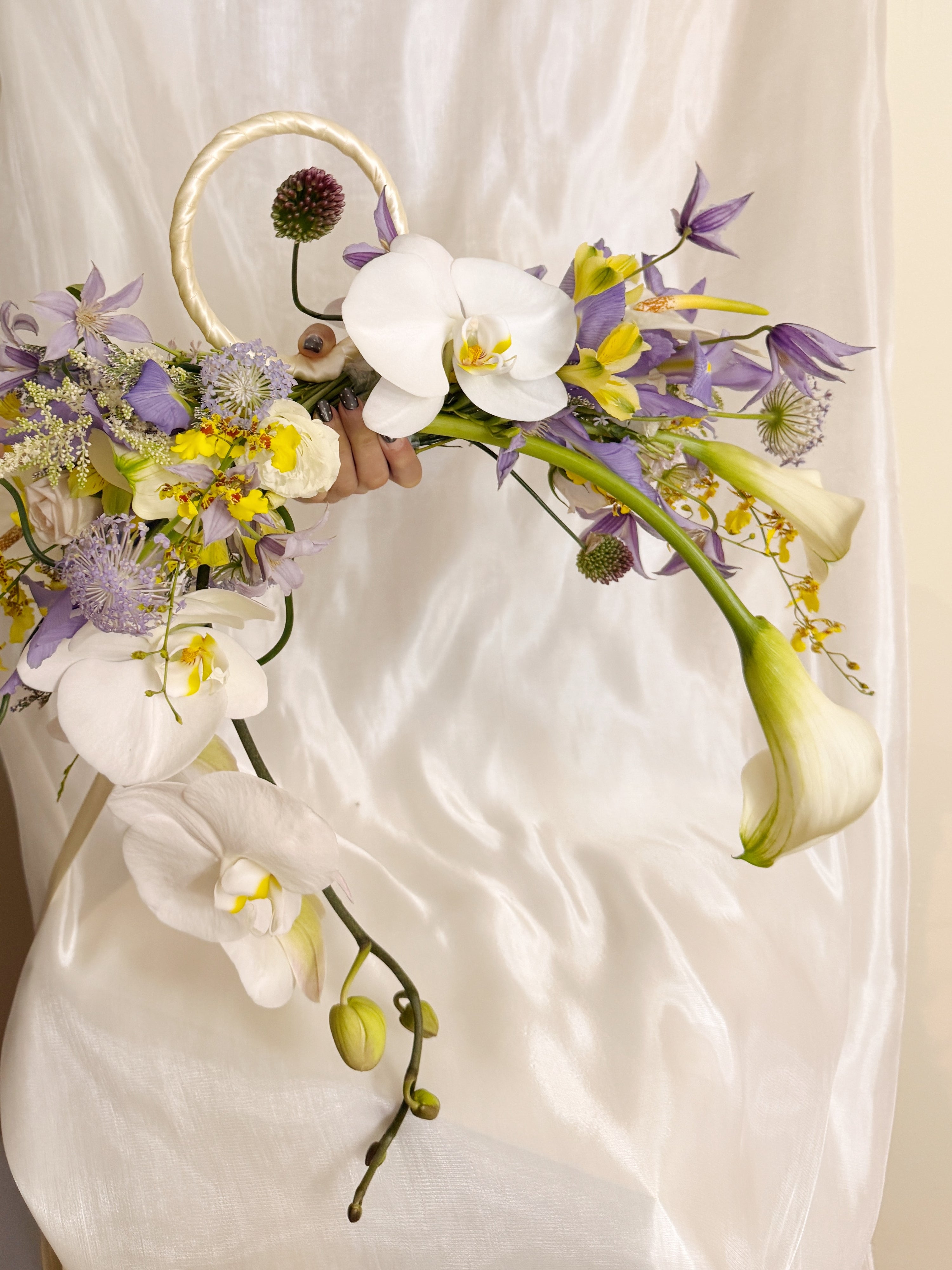 2026 Bridal Bouquet and Wedding Trend. Custom Bridal Bouquet Bag made with white Calla Lilies and Orchid, crafted by Eden's Ground.