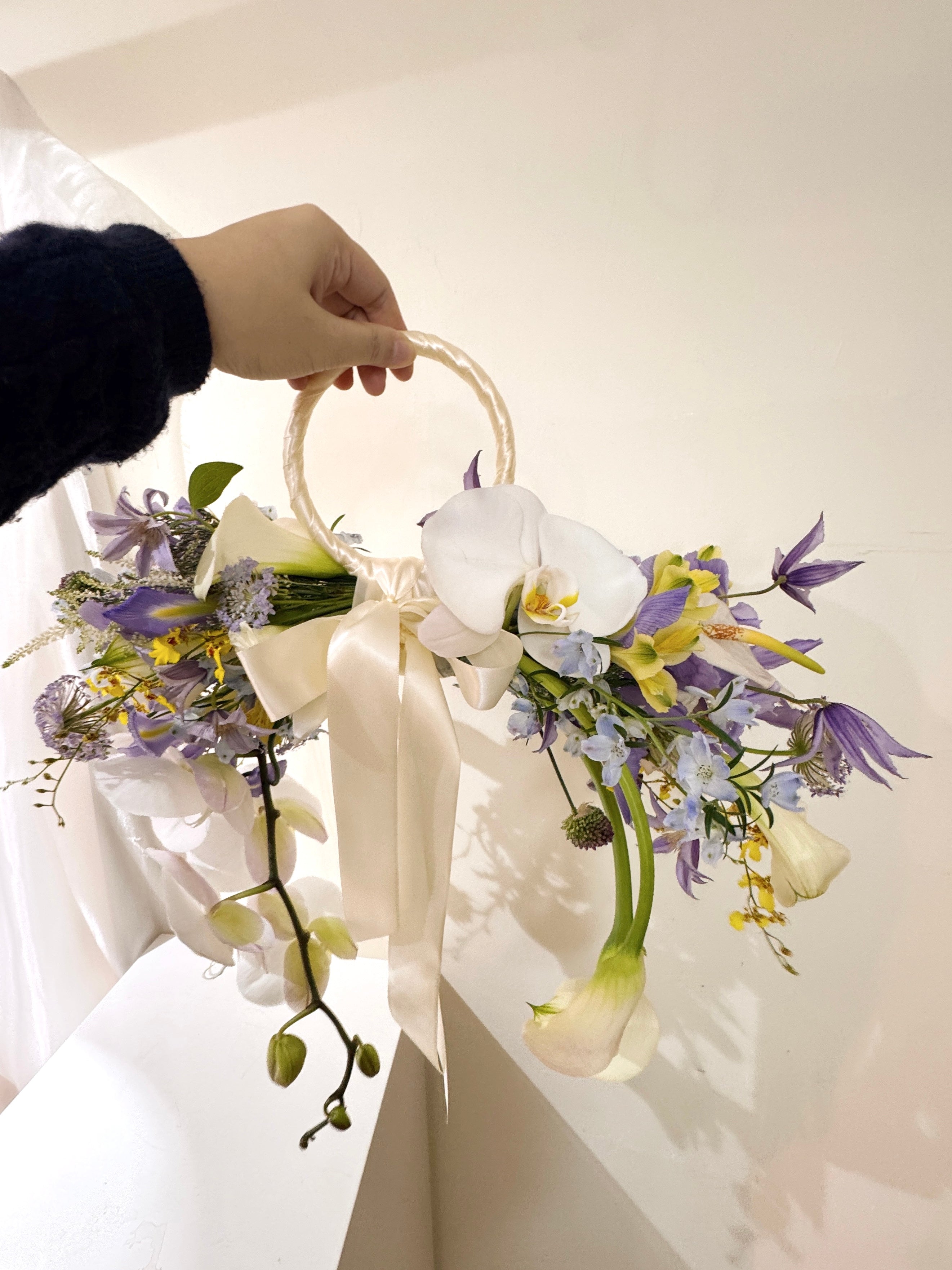 2026 Bridal Bouquet and Wedding Trend. Custom Bridal Bouquet Bag made with white Calla Lilies and Orchid, crafted by Eden's Ground.