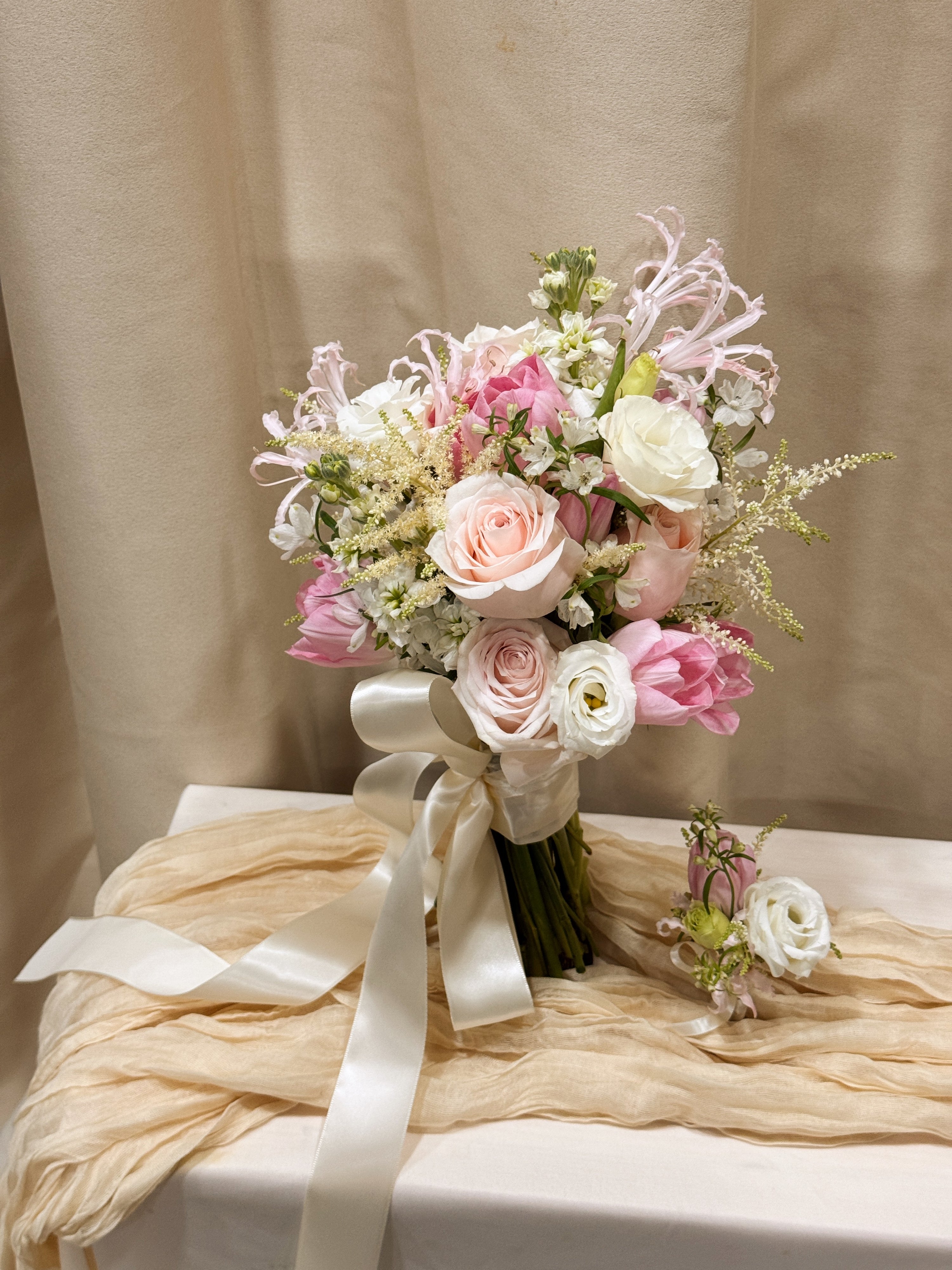 Custom Bridal Bouquet made with fresh Tulips and Roses crafted by Eden's Ground.