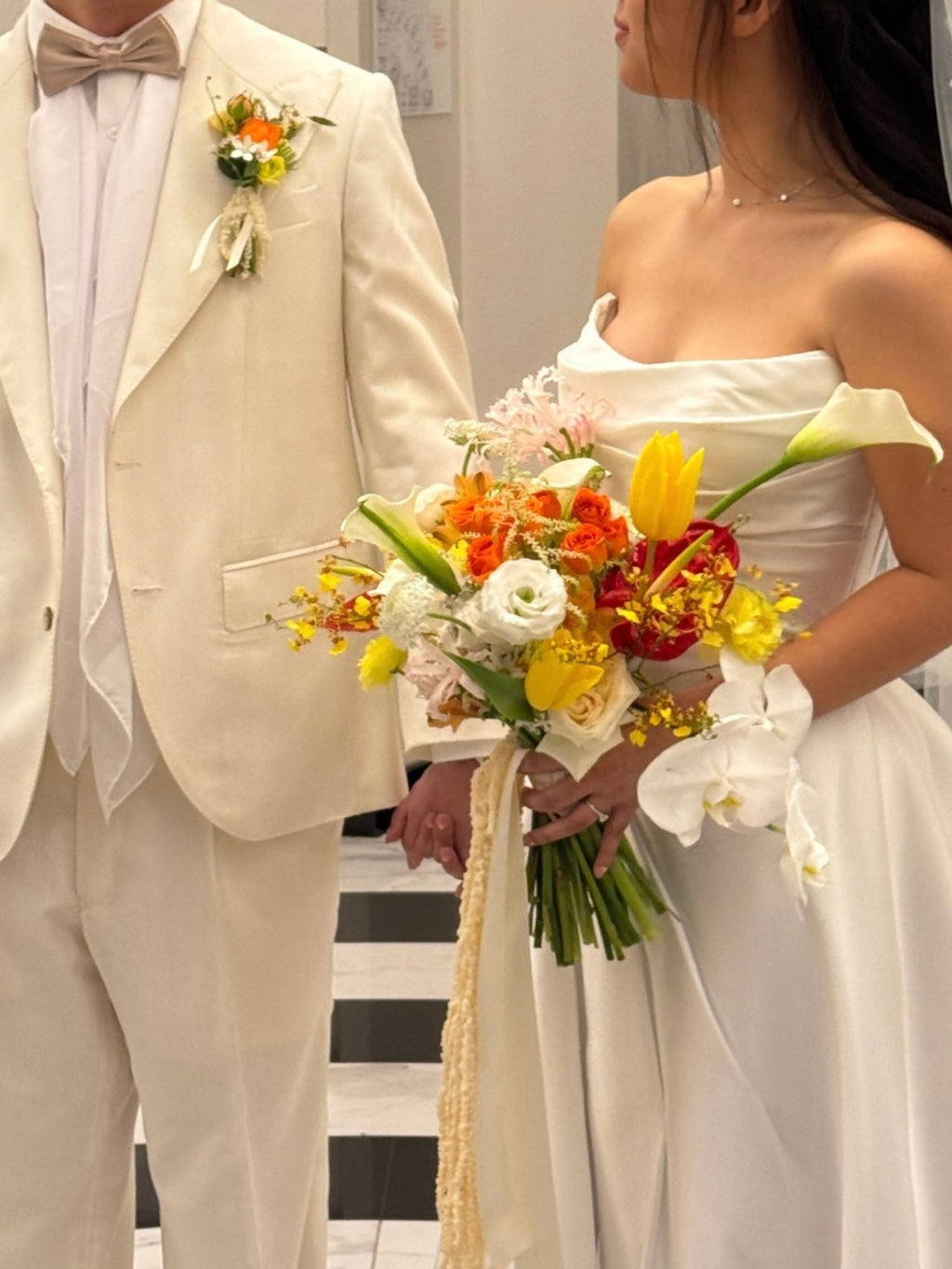 Custom Bridal Bouquet made with fresh Tulips and Roses crafted by Eden's Ground.
