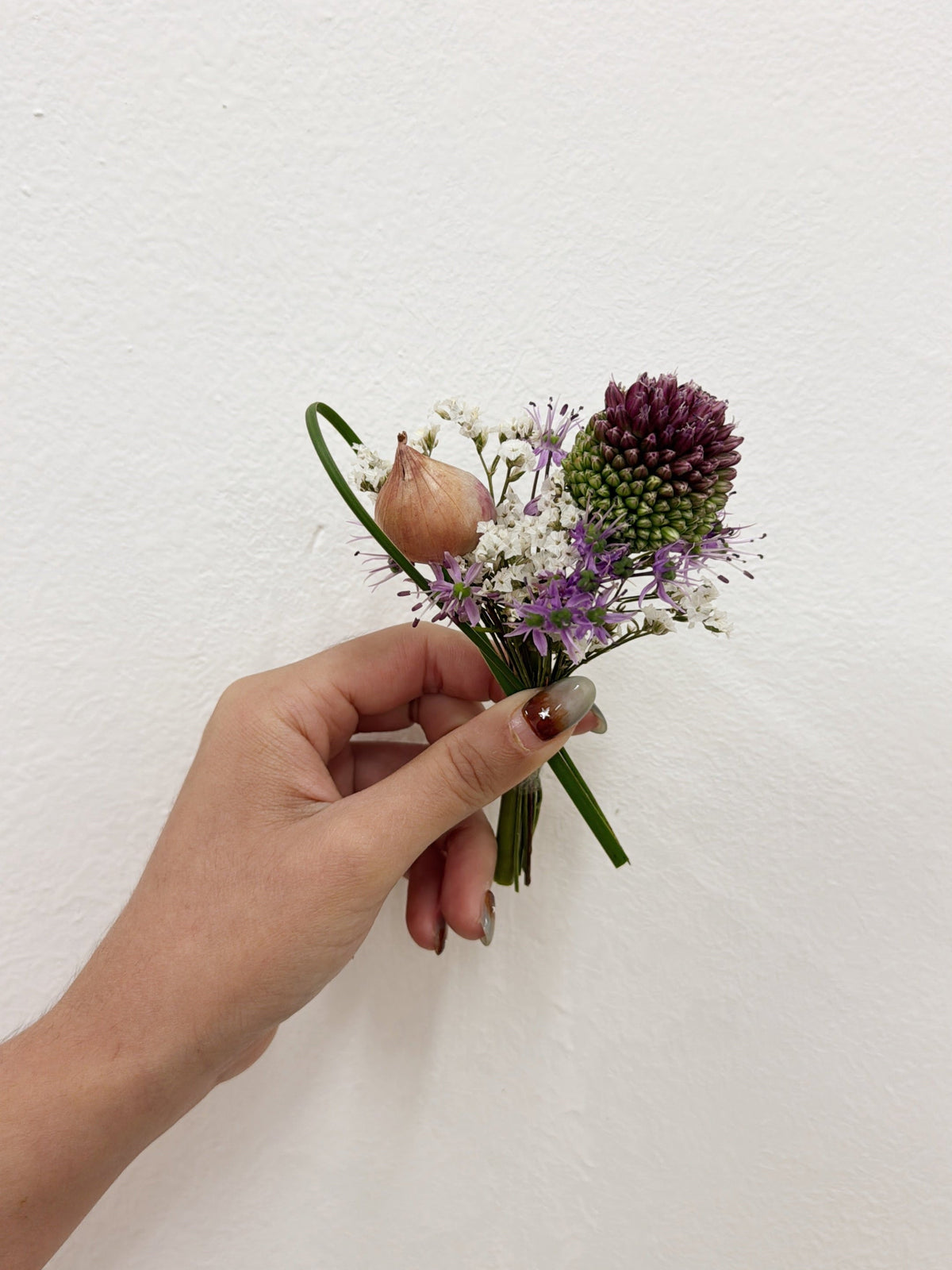 Bespoke boutonnières, including unique flowers, fruit and food materials to tell your story. For groom or VIP (parents) and groomsmen flowers, customised for your wedding event, crafted by Eden's Ground.