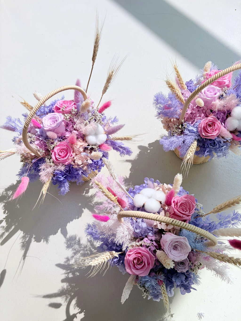 Bespoke floral basket gift for festive events like mother's day and valentine's day made with eternal everlasting flowers in vibrant colours for luxury brands in Singapore for gifting VIPs and VICs in Singapore, by Eden's Ground, a floral design studio.