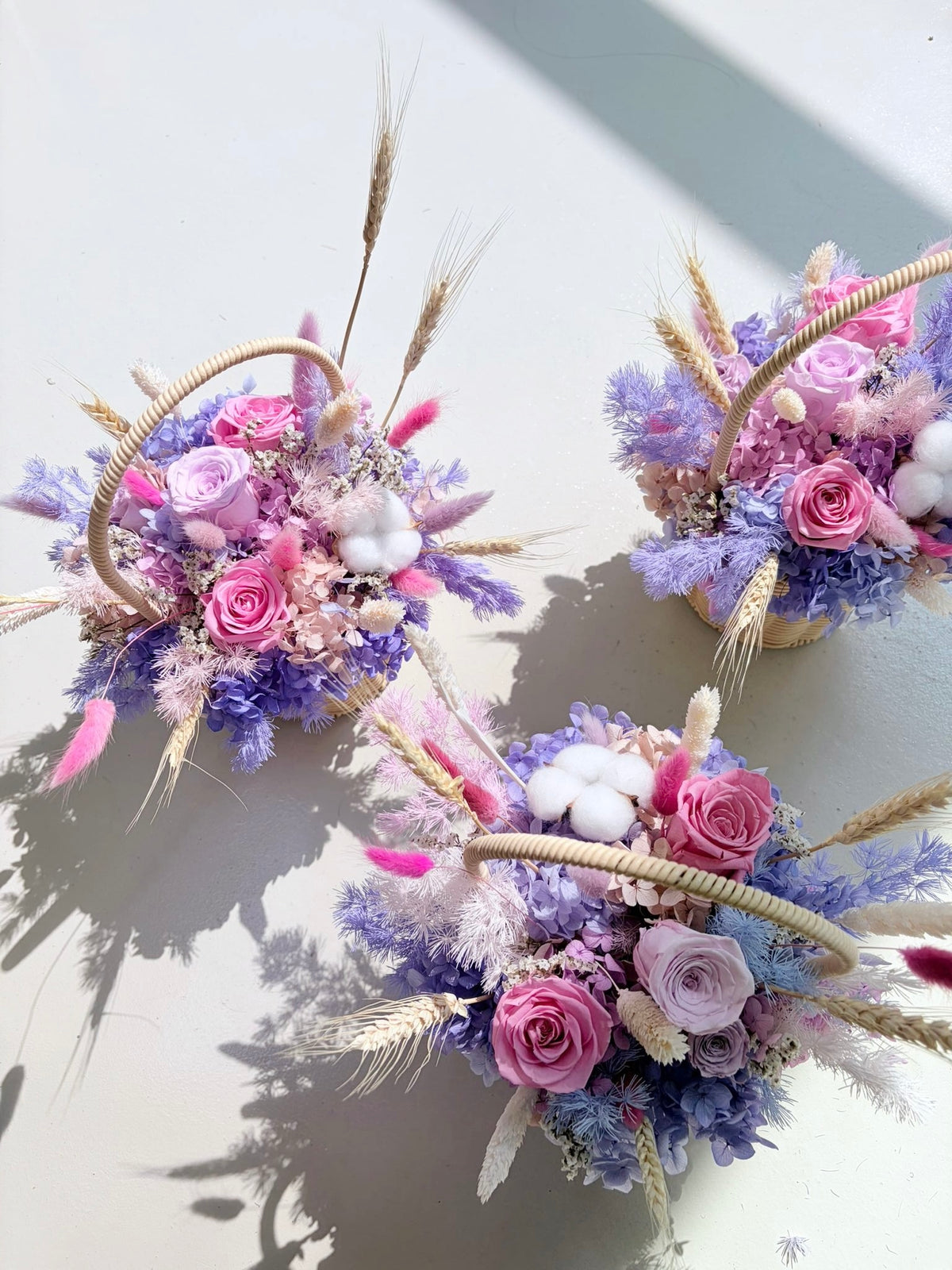 Bespoke floral basket gift for festive events like mother's day and valentine's day made with eternal everlasting flowers in vibrant colours for luxury brands in Singapore for gifting VIPs and VICs in Singapore, by Eden's Ground, a floral design studio.