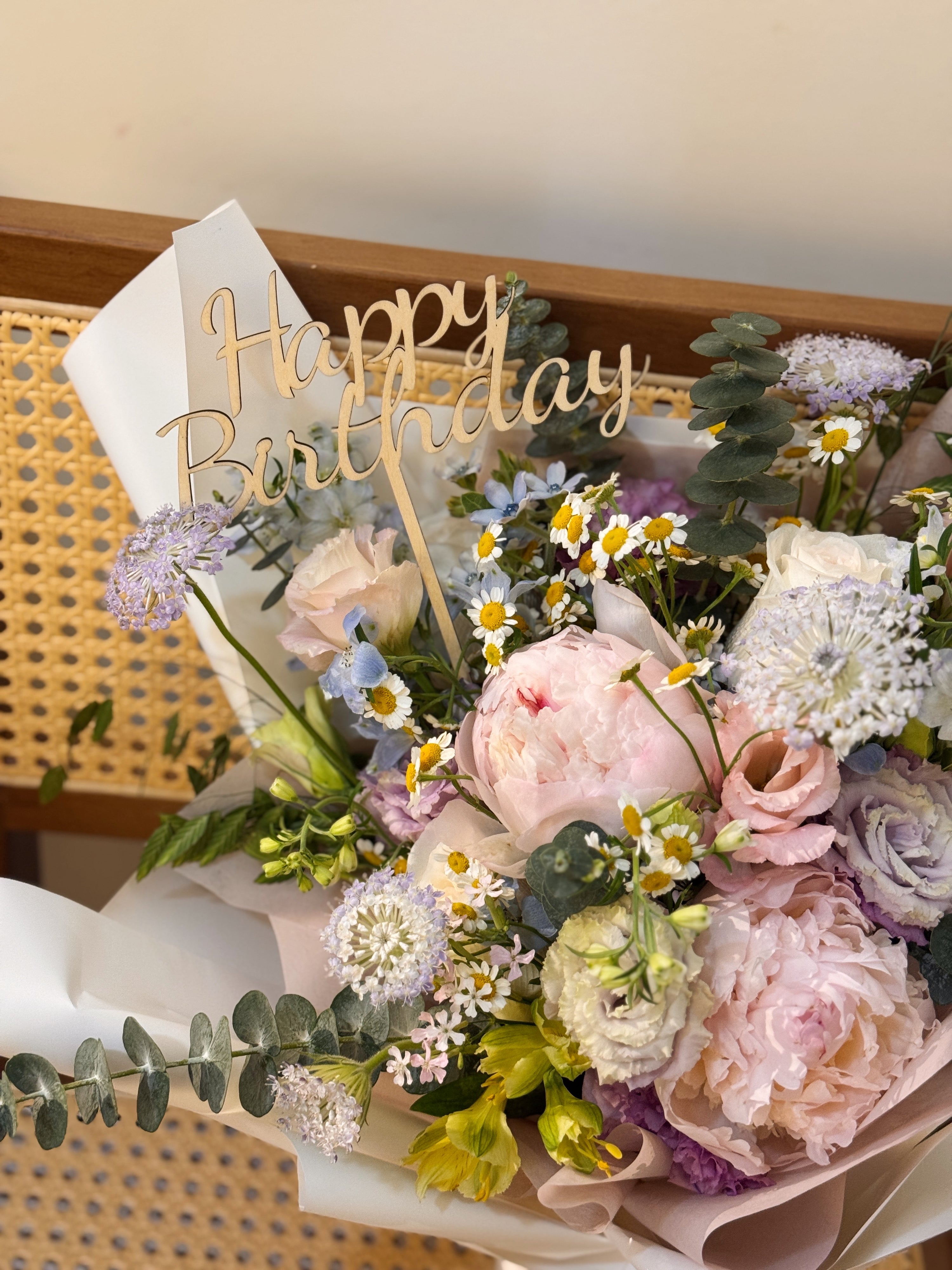 Happy Birthday wooden cake topper sign, crafted by Eden's Ground, a floral design studio in Singapore.