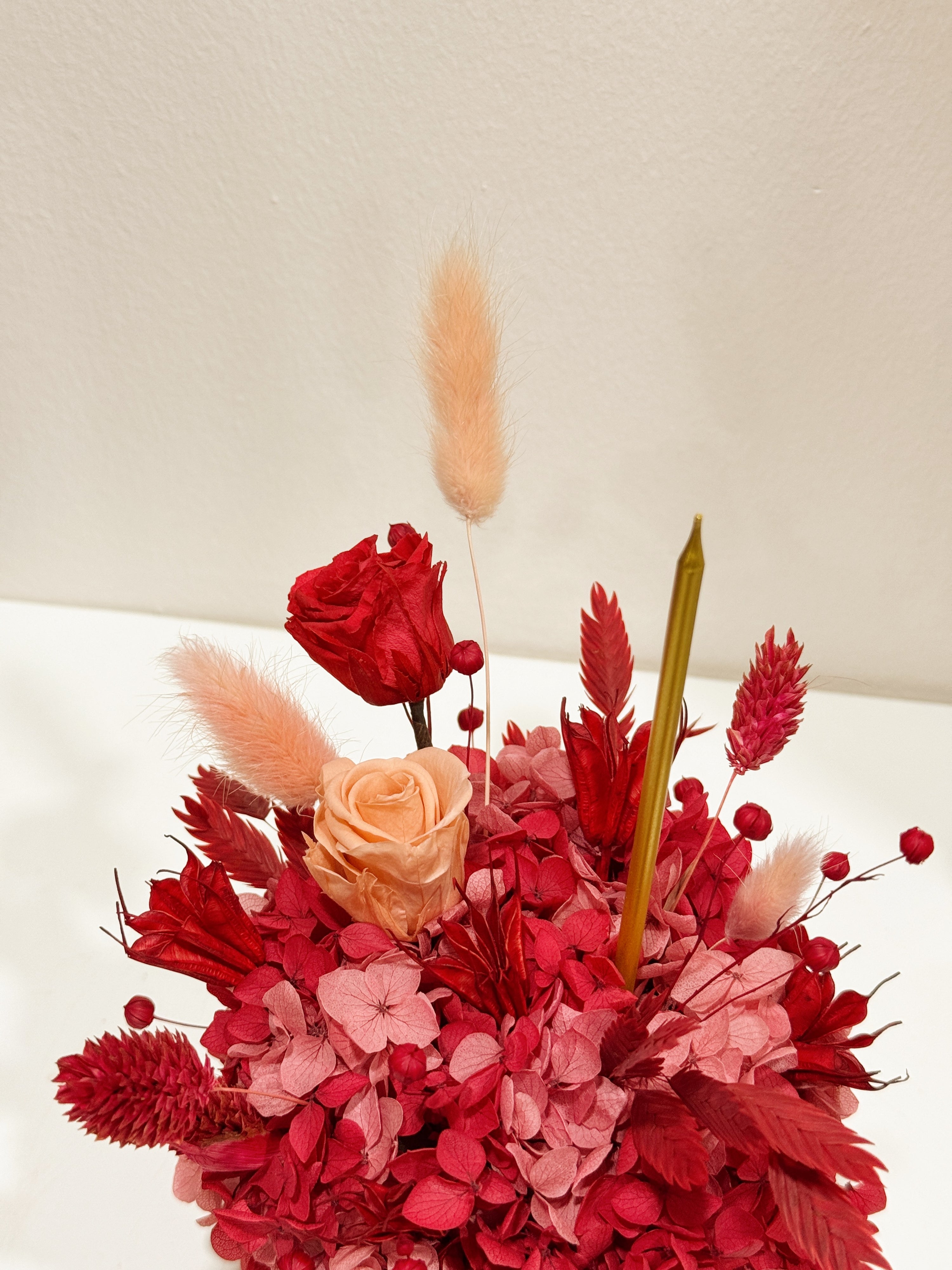 A flower birthday cake crafted with preserved flowers, perfect for a lasting birthday gift that celebrates love, joy and memories that never fade. Crafted by Eden's Ground, a floral design boutique.