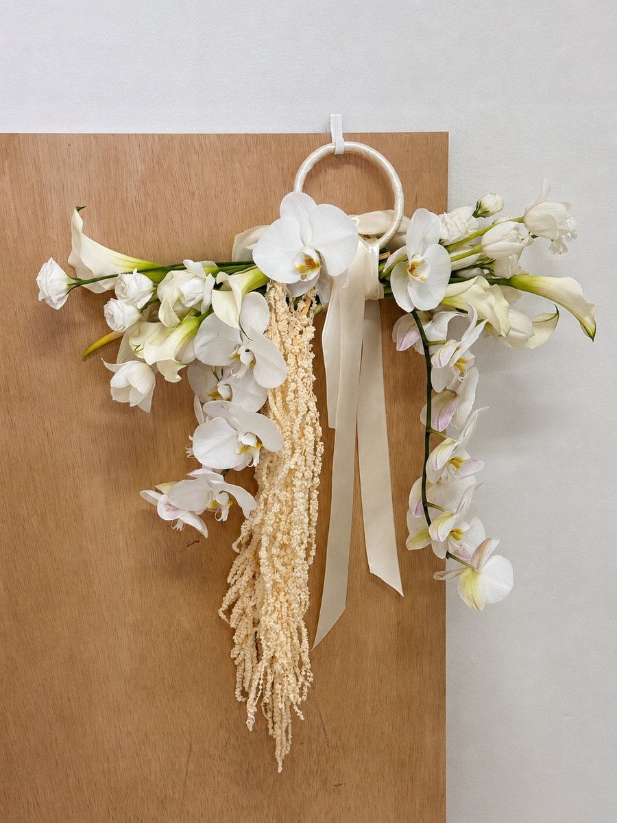 Top 2026 Bridal Bouquet and Wedding Trend. Custom Bridal Bouquet Bag made with white Calla Lilies and Orchid, crafted by Eden's Ground.