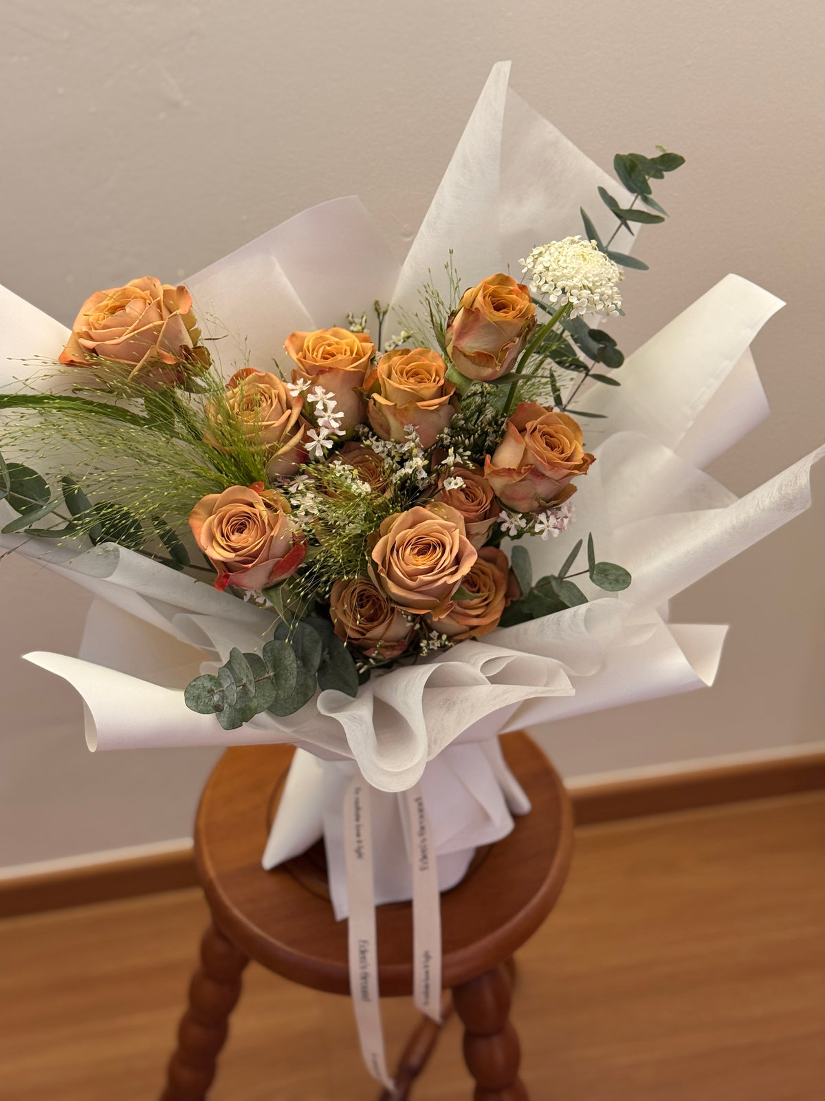 Ombre mocha like cappuccino roses bouquet wrapped in white tissue paper and white korean glassine paper crafted by Eden’s Ground. Perfect for Valentine's day for expressing appreciation, loyalty and a quiet, confident kind of romance.
