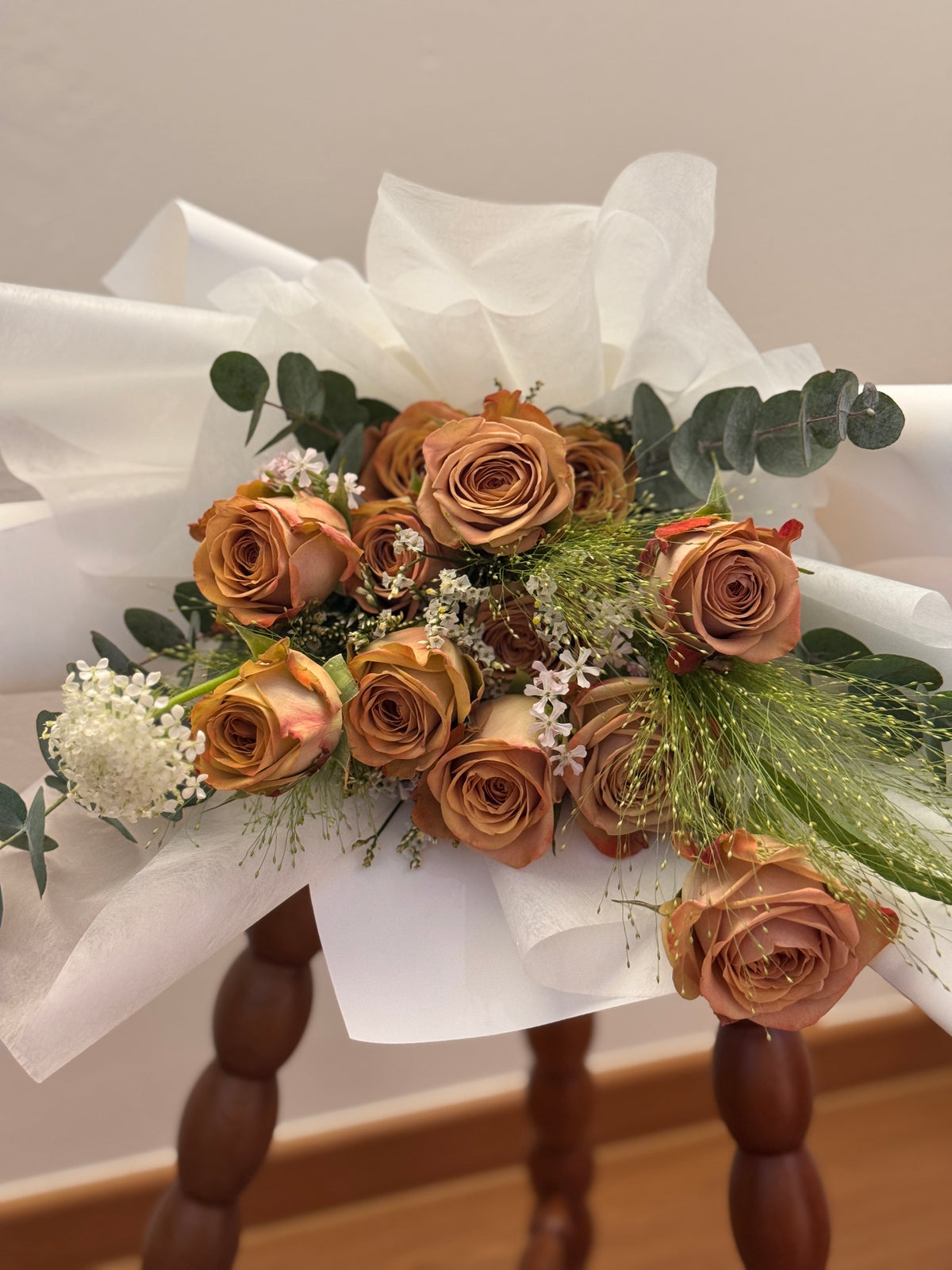 Ombre mocha like cappuccino roses bouquet wrapped in white tissue paper and white korean glassine paper crafted by Eden’s Ground. Perfect for Valentine's day for expressing appreciation, loyalty and a quiet, confident kind of romance.