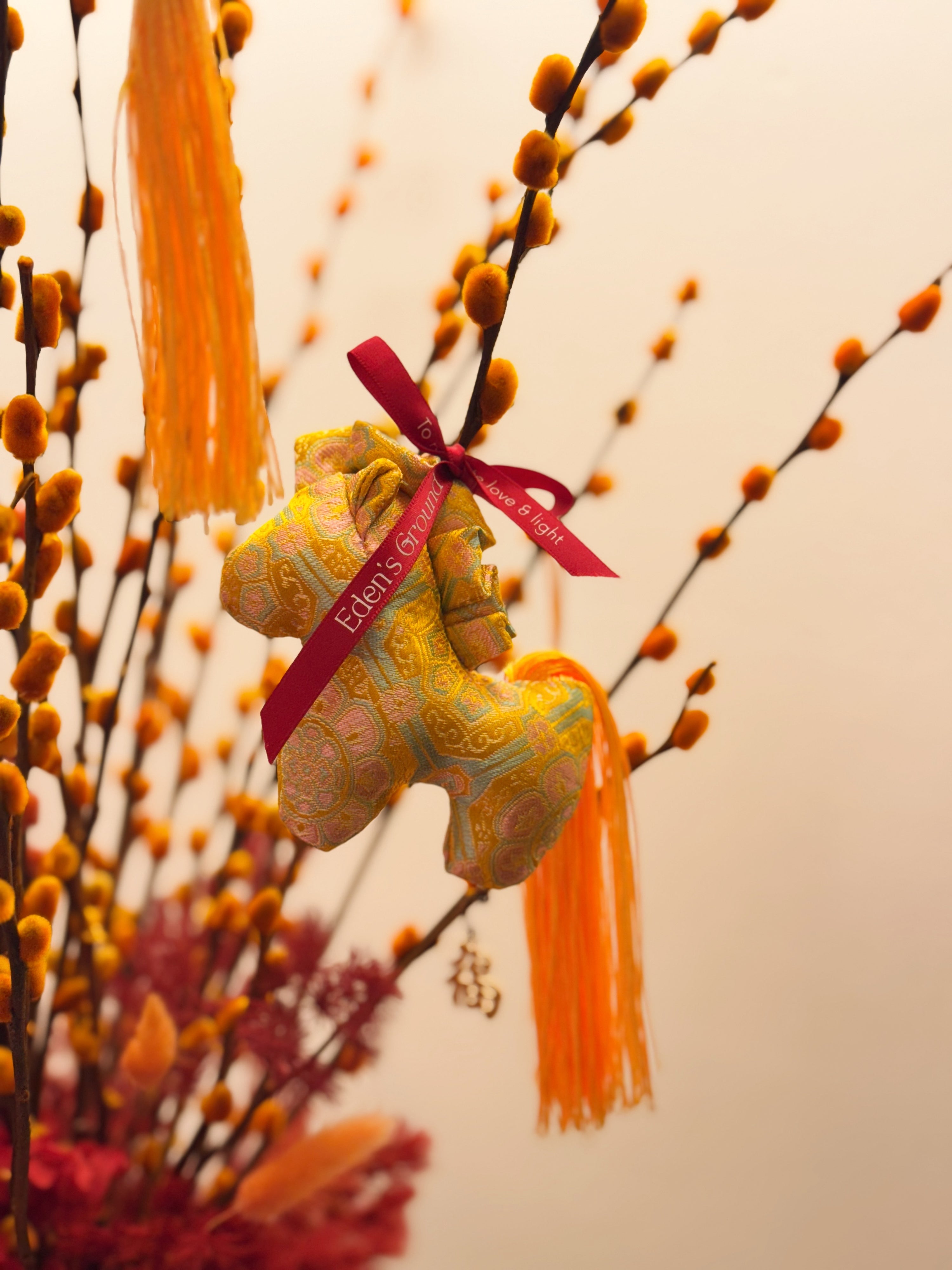 Chinese New Year 2026 Pussy Willow Flower Box, featuring orange and gold pussy willow cny flower, everlasting preserved hydrangeas, decorated with red tassles and 福 to usher in wealth, abundance, prosperity and all the good vibes for the lunar new year, crafted by Eden's Ground, a floral design studio in Singapore. Delivered straight to your doorstep.