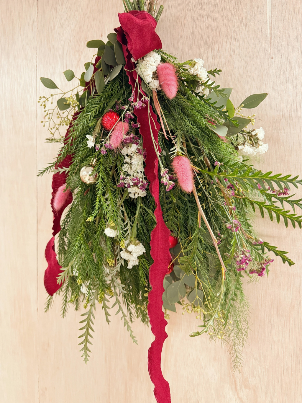 A Christmas swag Workshop in Singapore by Eden's Ground. Create your own festive decorative door swag arrangement using a variety of fresh firs, pine, foliage like eucalyptus, and natural textures and flowers. Held at our cosy floral studio in Tai Seng, it's the perfect hands-on holiday experience to get into the Christmas spirit.