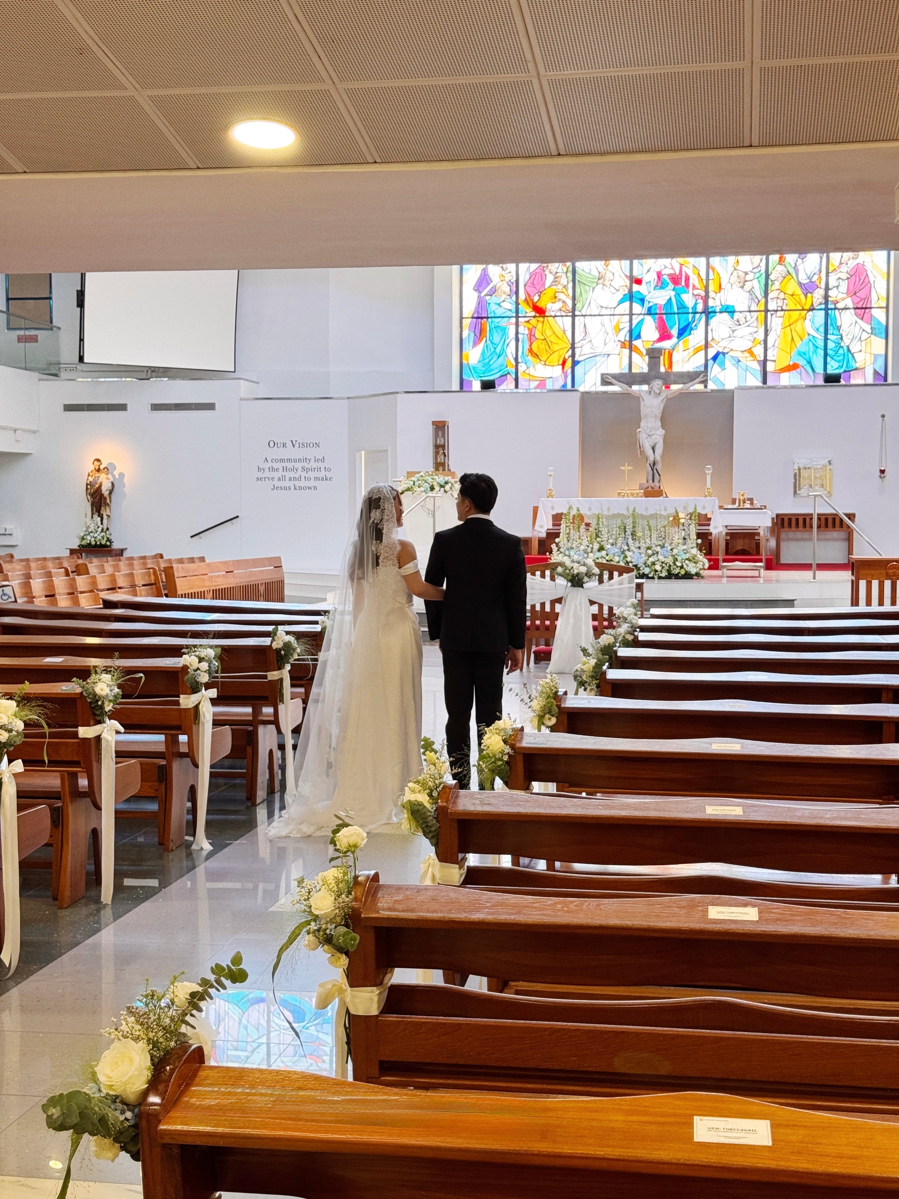 Church aisle pew flowers, craffted with fresh flowers by Eden's Ground, a floral design boutique.
