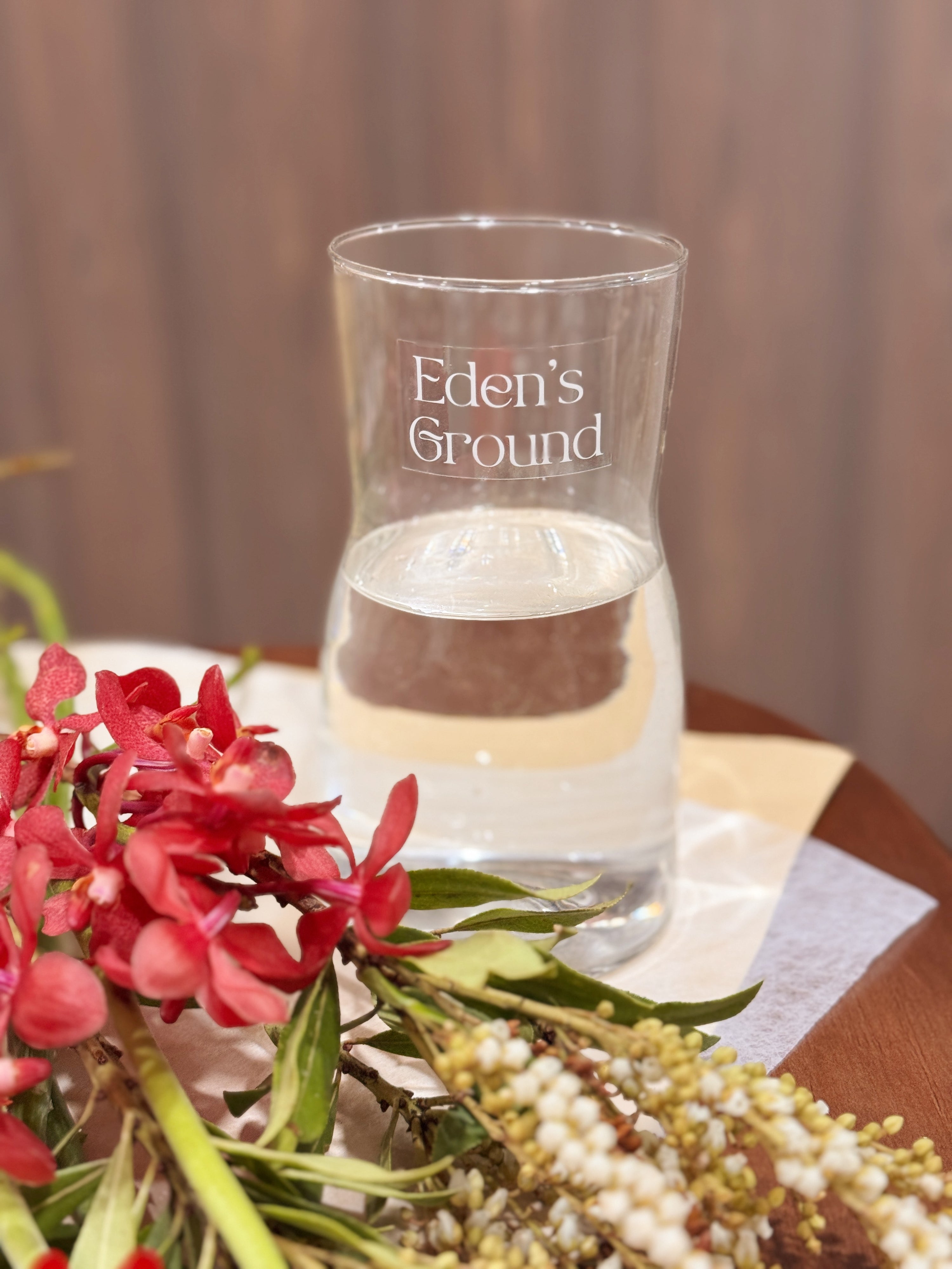Clear glass vase, suitable for flower vase arrangements. Available at Eden's Ground, a floral design boutique.