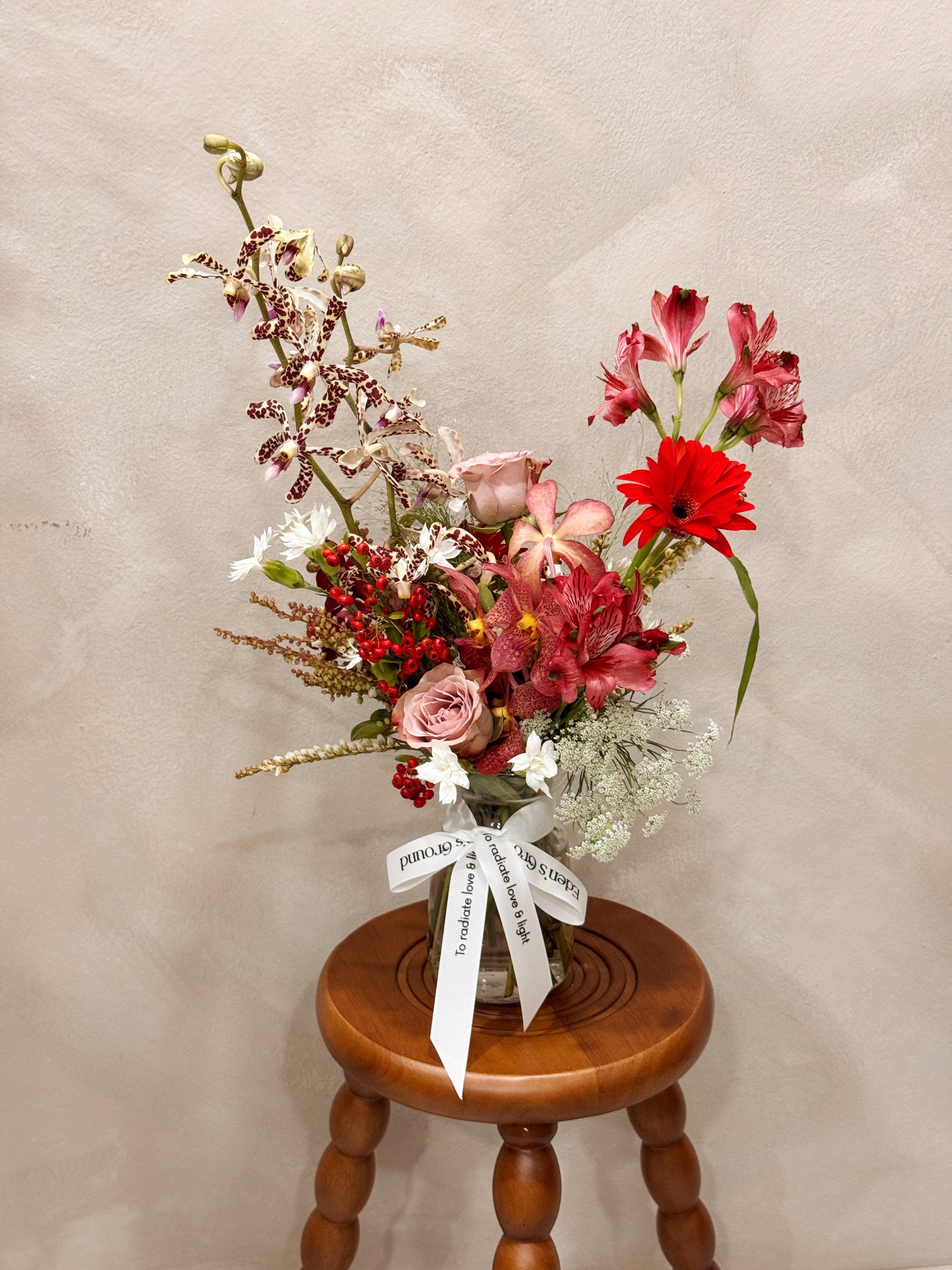 Petite clear glass vase, suitable for flower vase arrangements. Available at Eden's Ground, a floral design boutique.
