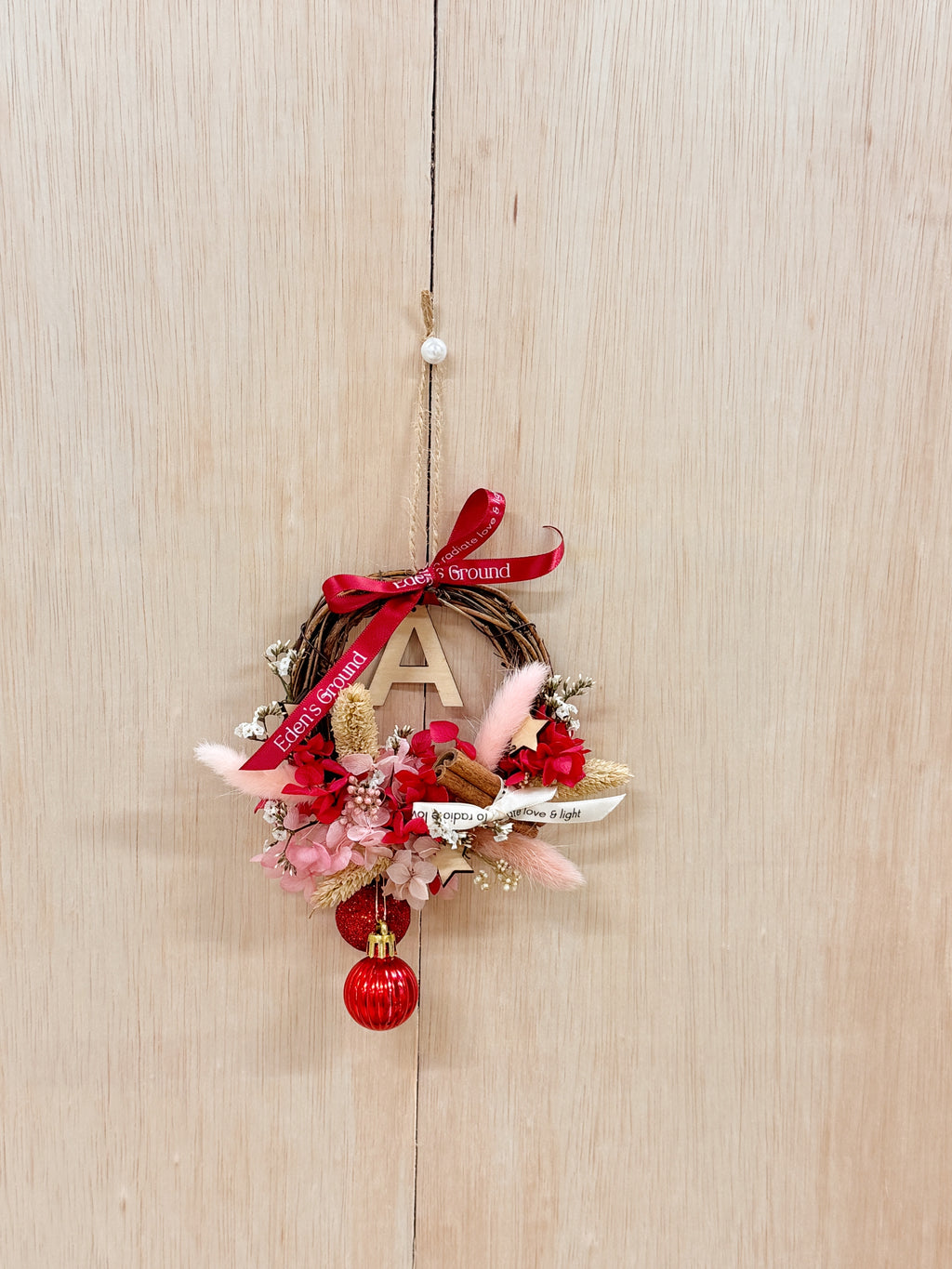 Preserved and Dried DIY Kit Christmas Wreath, decorated with baubles, ornaments, cinnamon sticks, hydrangeas and more by Eden's Ground, a Floral Design Studio in Singapore.