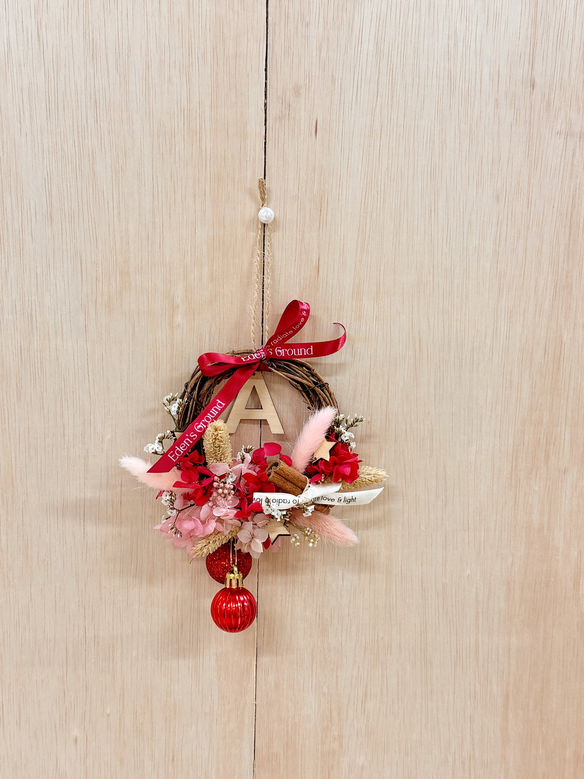 Preserved and Dried DIY Kit Christmas Wreath, decorated with baubles, ornaments, cinnamon sticks, hydrangeas and more by Eden's Ground, a Floral Design Studio in Singapore.