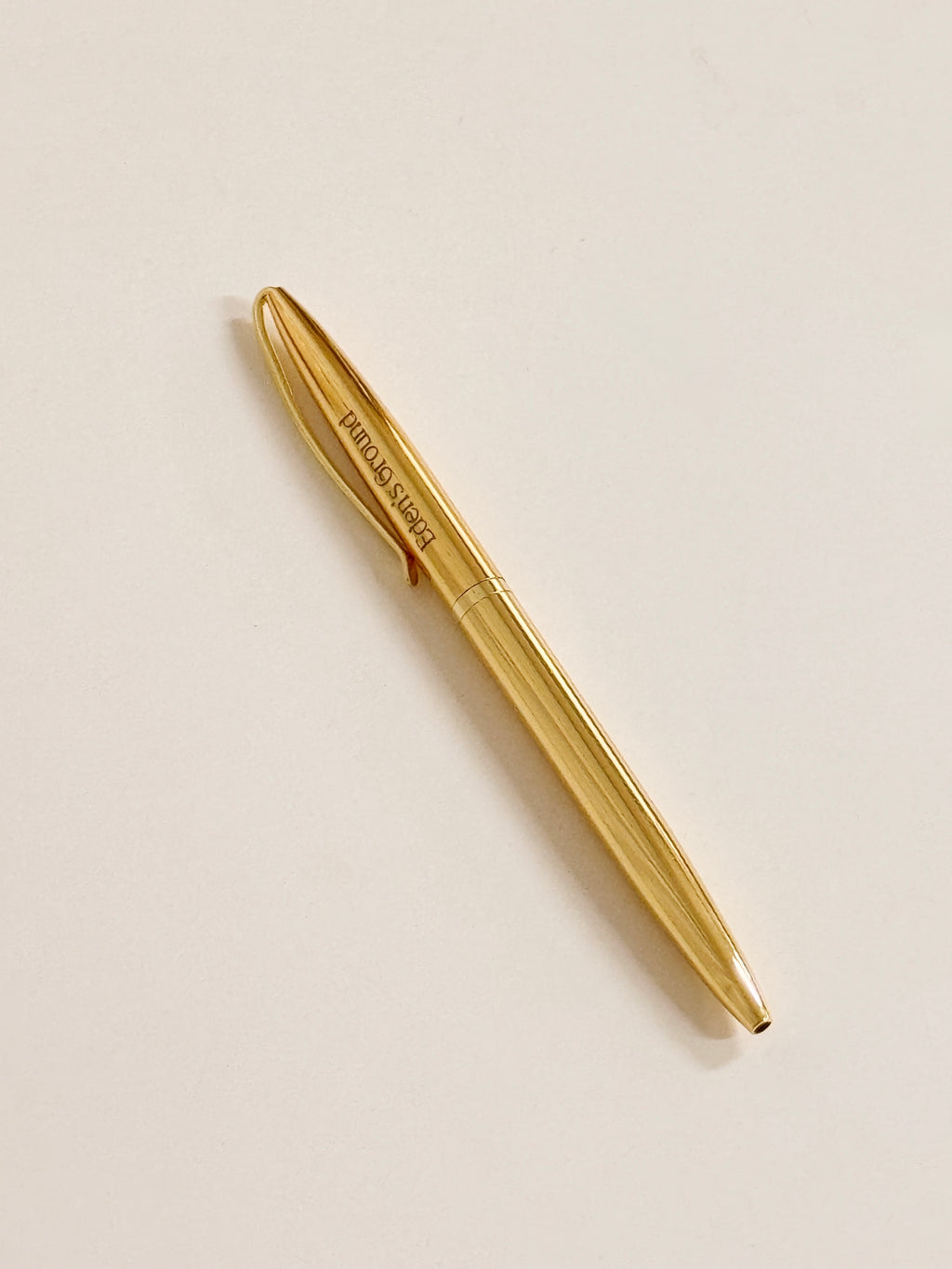 An elegant gold ballpoint pen with a smooth writing flow.