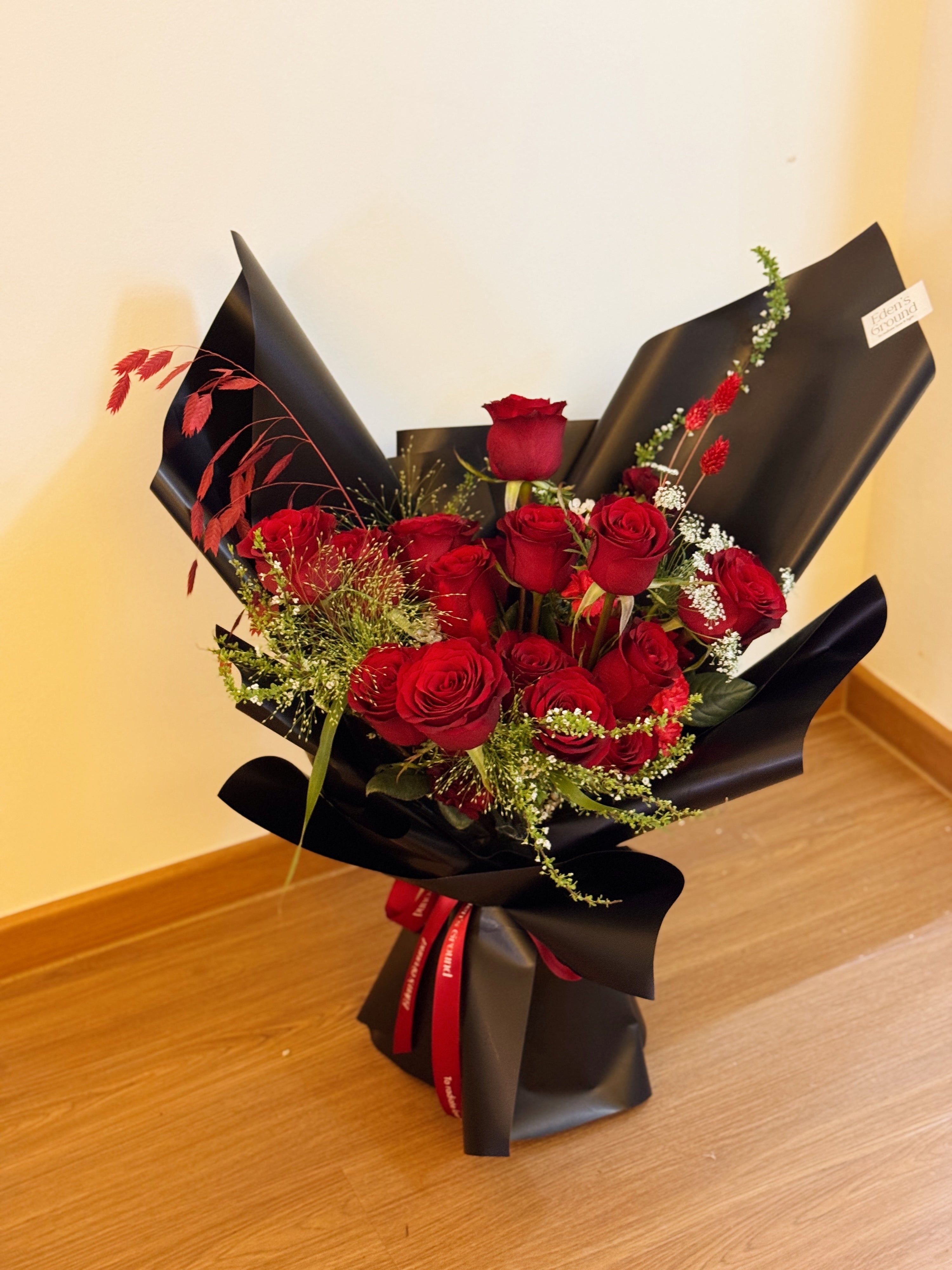 Classic Red Roses Korean-Style Bouquet, wrapped in black paper crafted by Eden’s Ground.