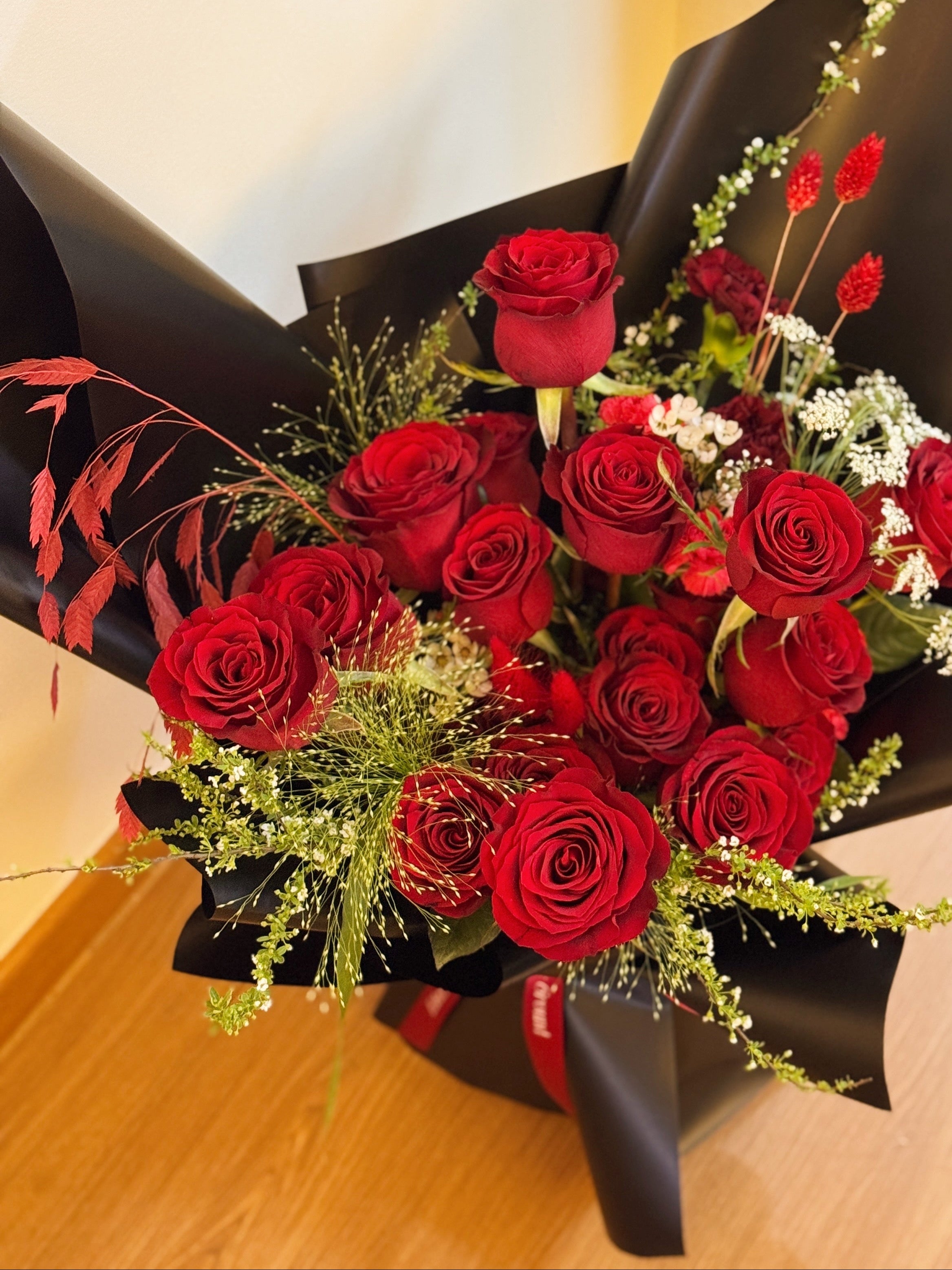 Classic Red Roses Korean-Style Bouquet, wrapped in black paper crafted by Eden’s Ground.