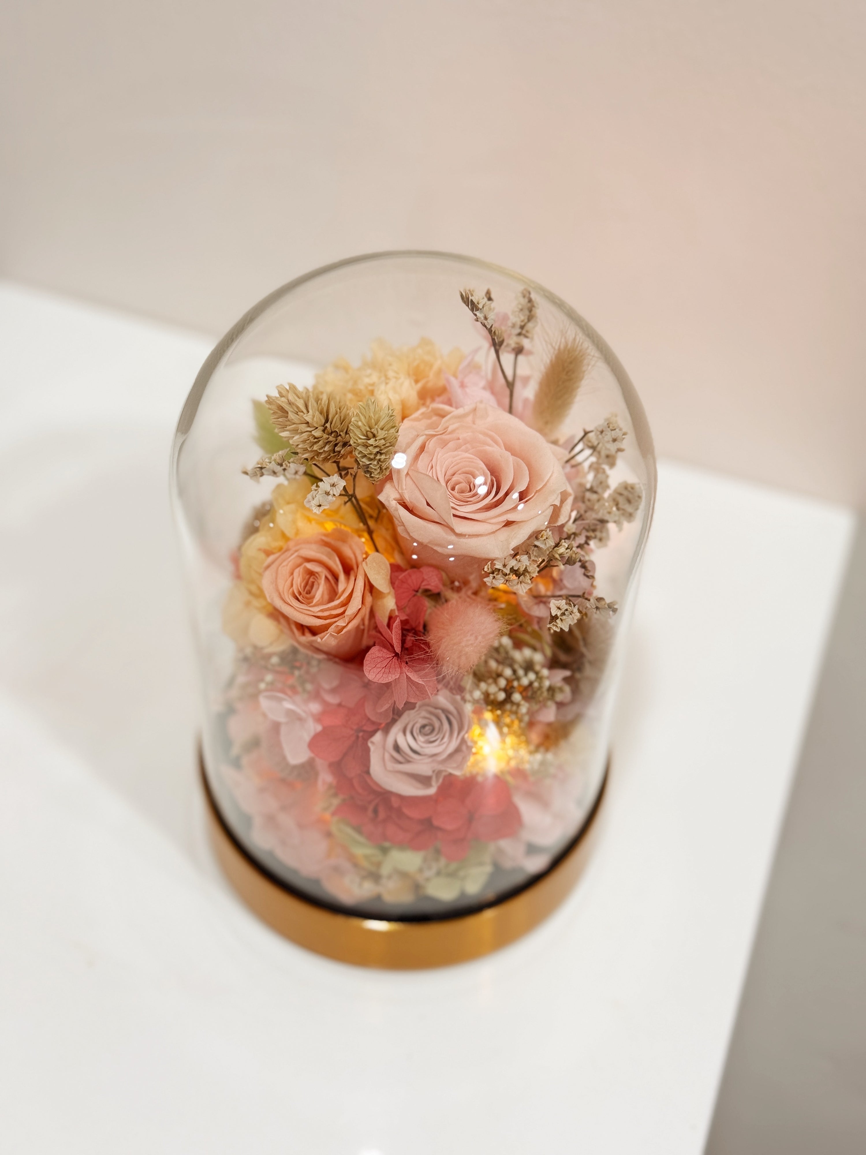 Ethereal Embrace Flower Dome is made with a delicate blend of preserved and dried flowers in a variety of vibrant colours, beautifully arranged in a glass dome by Eden’s Ground—an unforgettable gift or home decor made to last. 