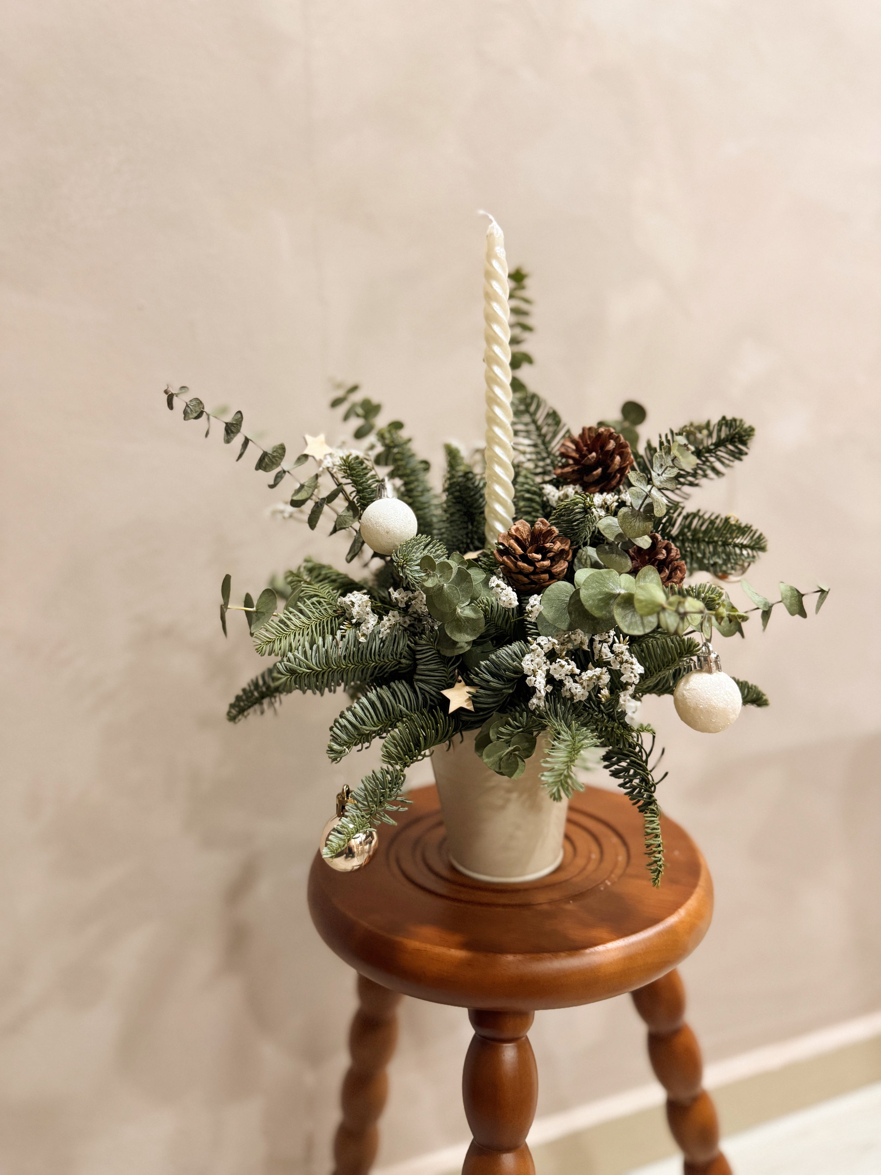 Fresh Christmas Bloom Box with candle, decorated with stars and baubles for setting the dinner table and mood. By Eden's Ground, a Floral Design Studio in Singapore.