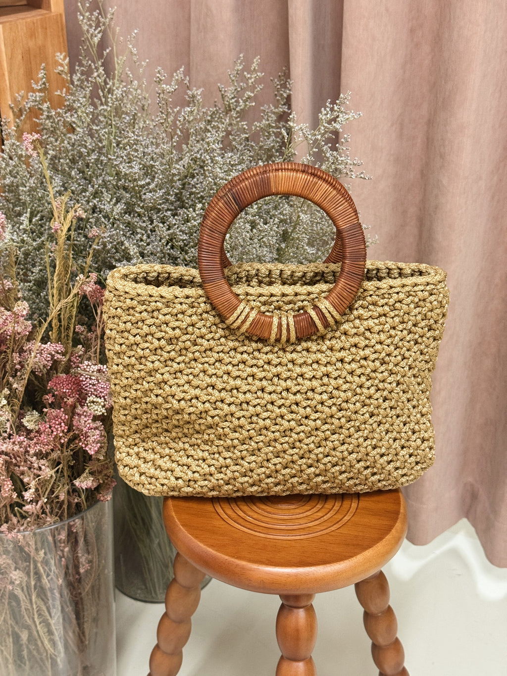 Hand-crocheted woven bag with round natural rattan handle, handmade locally in Singapore, by Li Na Lay Nar as an expression of a mother's love birthday present gift idea high fashion.
