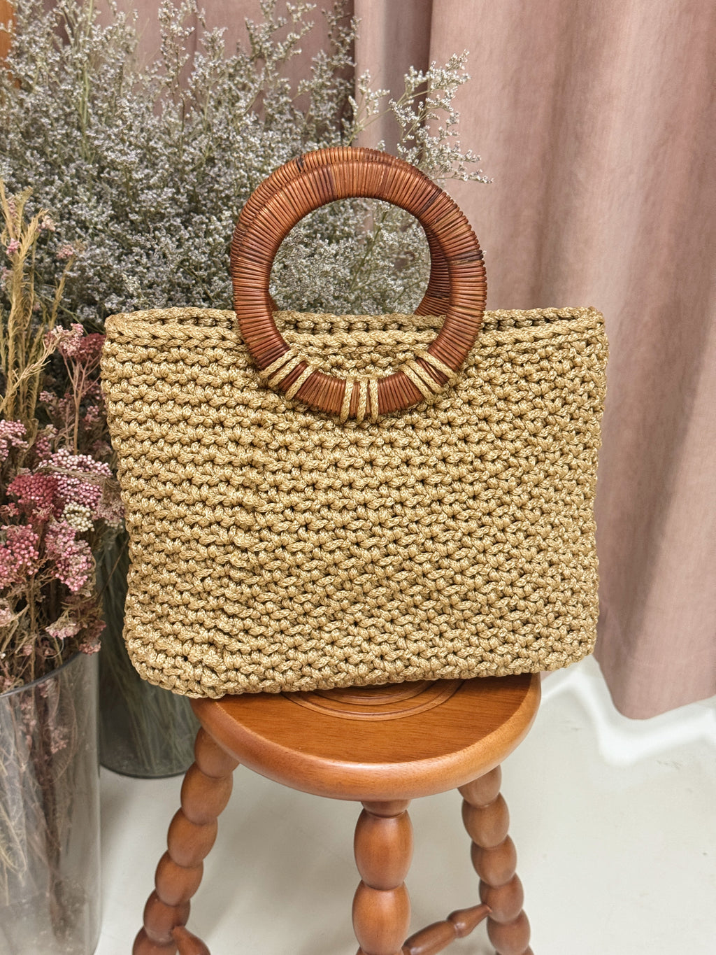 Hand-crocheted woven bag with round natural rattan handle, handmade locally in Singapore, by Li Na Lay Nar as an expression of a mother's love birthday present gift idea high fashion.