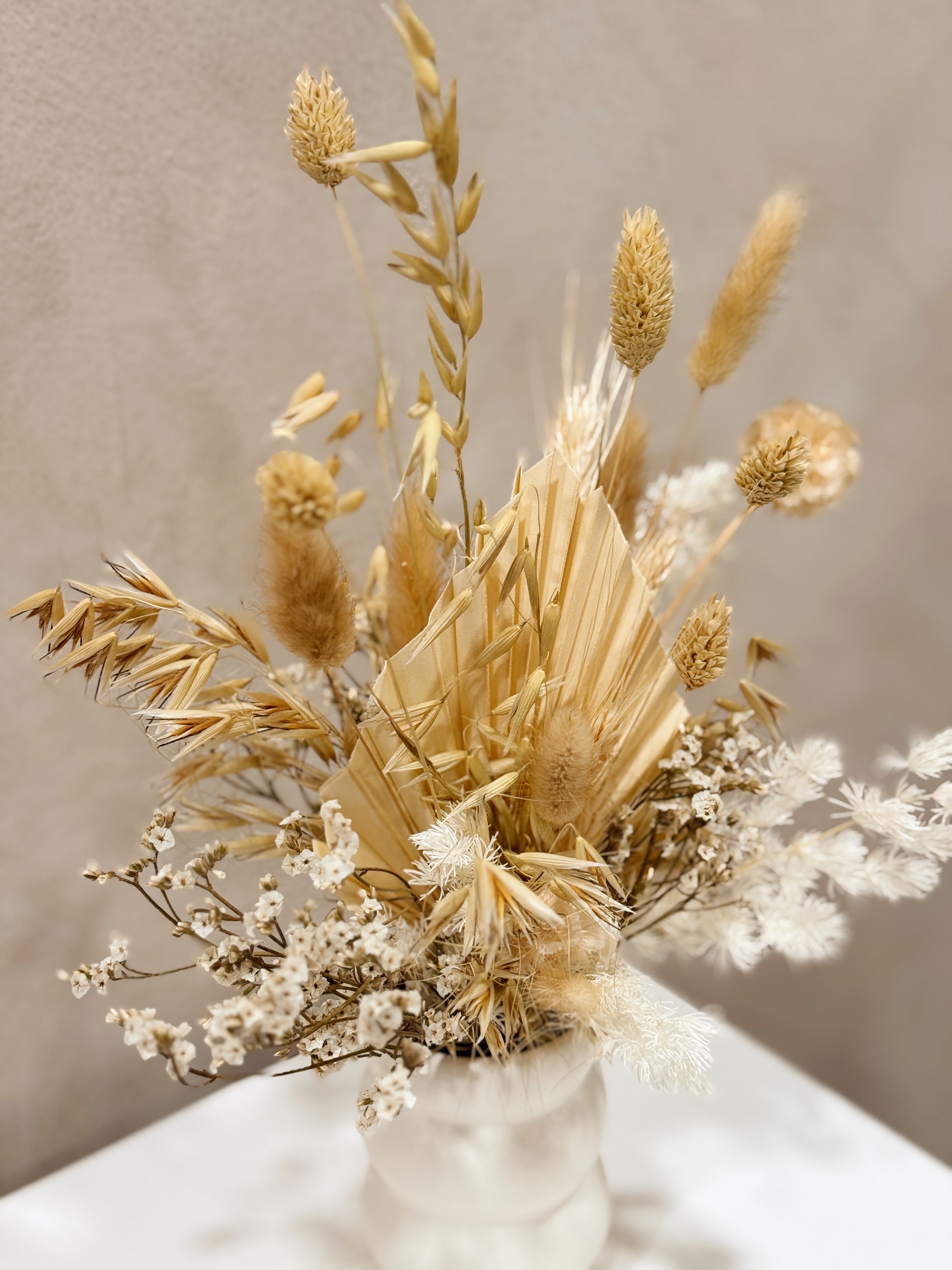 The Ivory Meadow vase arrangement by Eden’s Ground featuring everlasting florals in soft, earthy tones — thoughtfully styled in a matte porcelain vase. Low-maintenance and long-lasting, it's perfect as a housewarming gift or as a timeless piece of home décor.