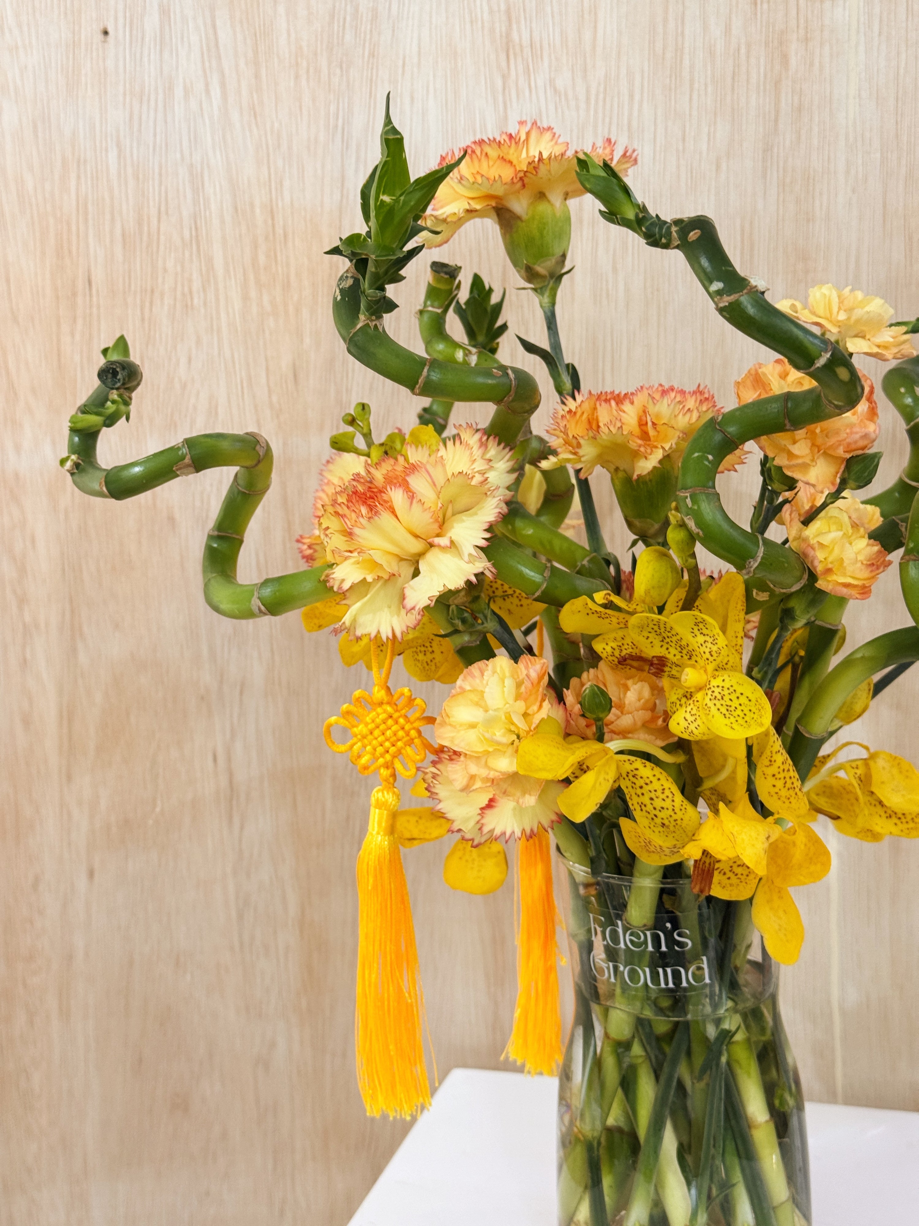 Chinese New Year 2026 Lucky Bamboo Fresh Flower Vase Arrangement, CNY 2026 Flowers, featuring auspicious 8 stalks of lucky bamboo with orchid cny flower, to usher in wealth, abundance, prosperity and all the good vibes for the lunar new year, crafted by Eden's Ground, a floral design studio in Singapore. Delivered straight to your doorstep.