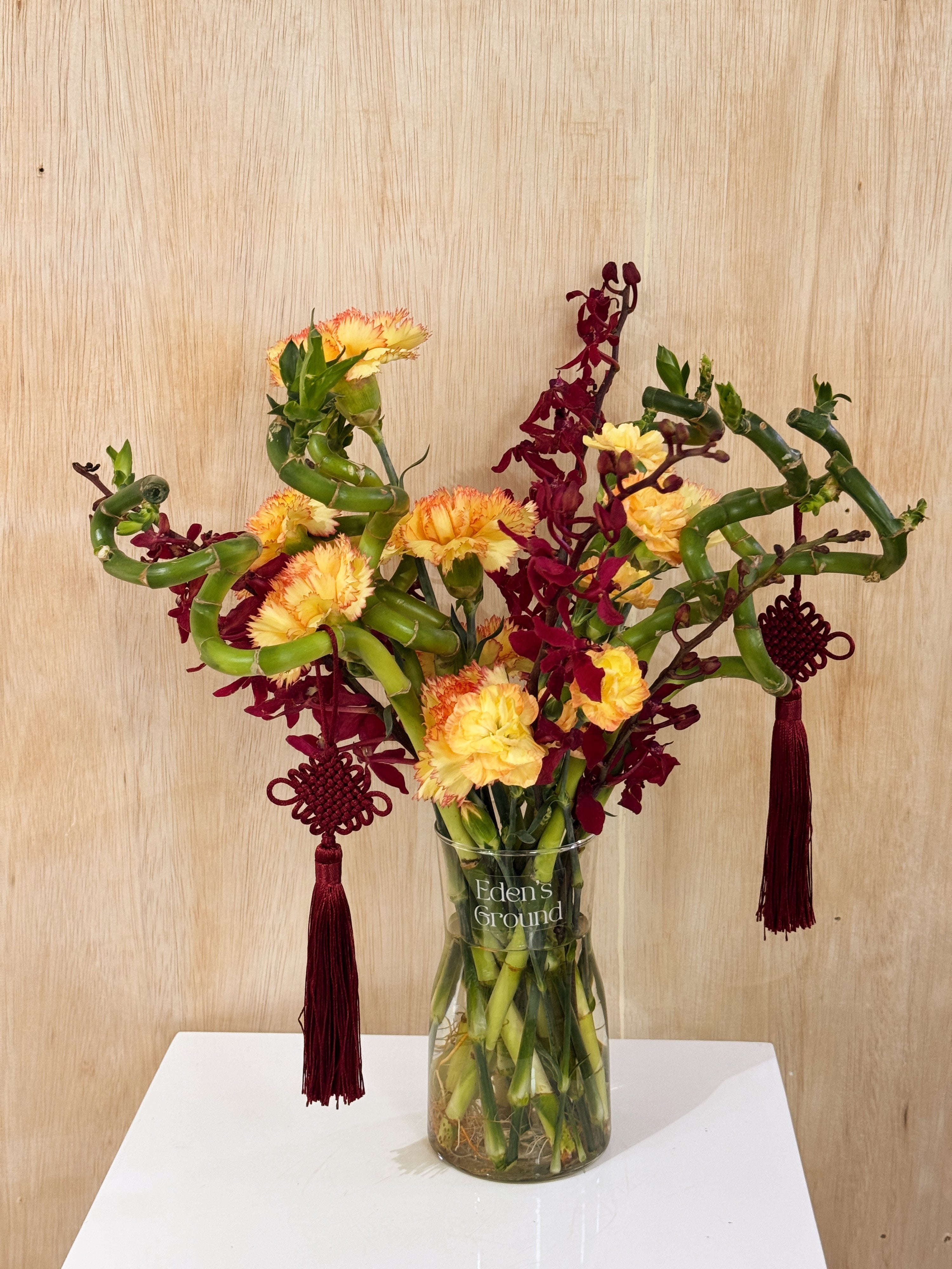 Chinese New Year 2026 Lucky Bamboo Fresh Flower Vase Arrangement, CNY 2026 Flowers, featuring auspicious 8 stalks of lucky bamboo with orchid cny flower, to usher in wealth, abundance, prosperity and all the good vibes for the lunar new year, crafted by Eden's Ground, a floral design studio in Singapore. Delivered straight to your doorstep.