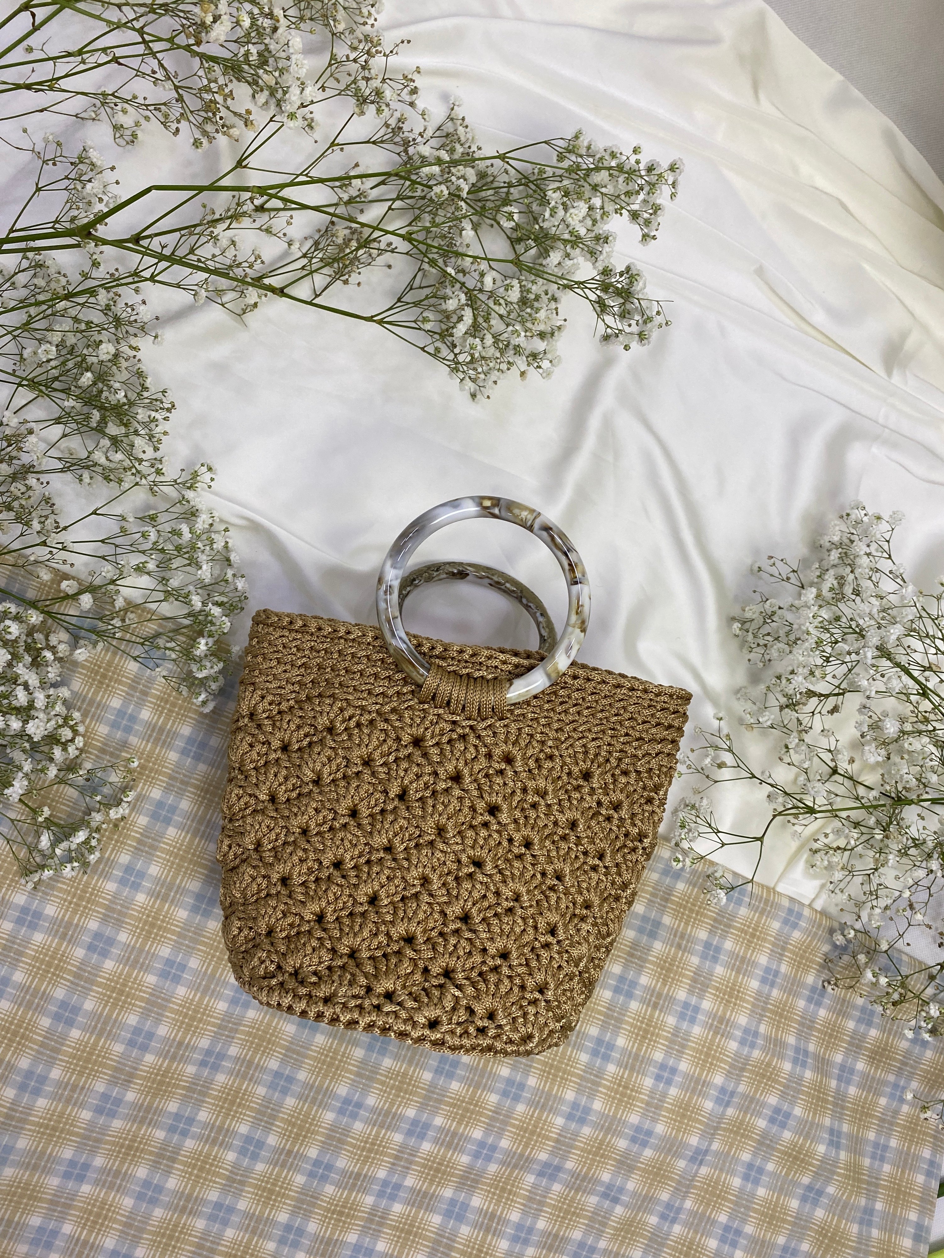 Handmade crochet bags and purses crafted in Singapore by Li Na Lay Nar. Mini Crochet Basket Bag with seashell weave design, perfect for everyday wear or as a statement piece.