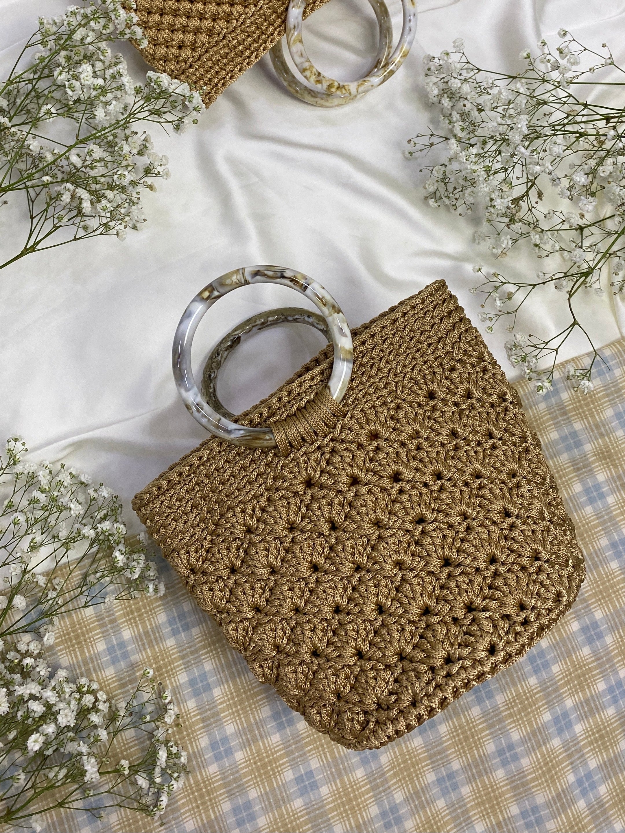 Handmade crochet bags and purses crafted in Singapore by Li Na Lay Nar. Mini Crochet Basket Bag with seashell weave design, perfect for everyday wear or as a statement piece.
