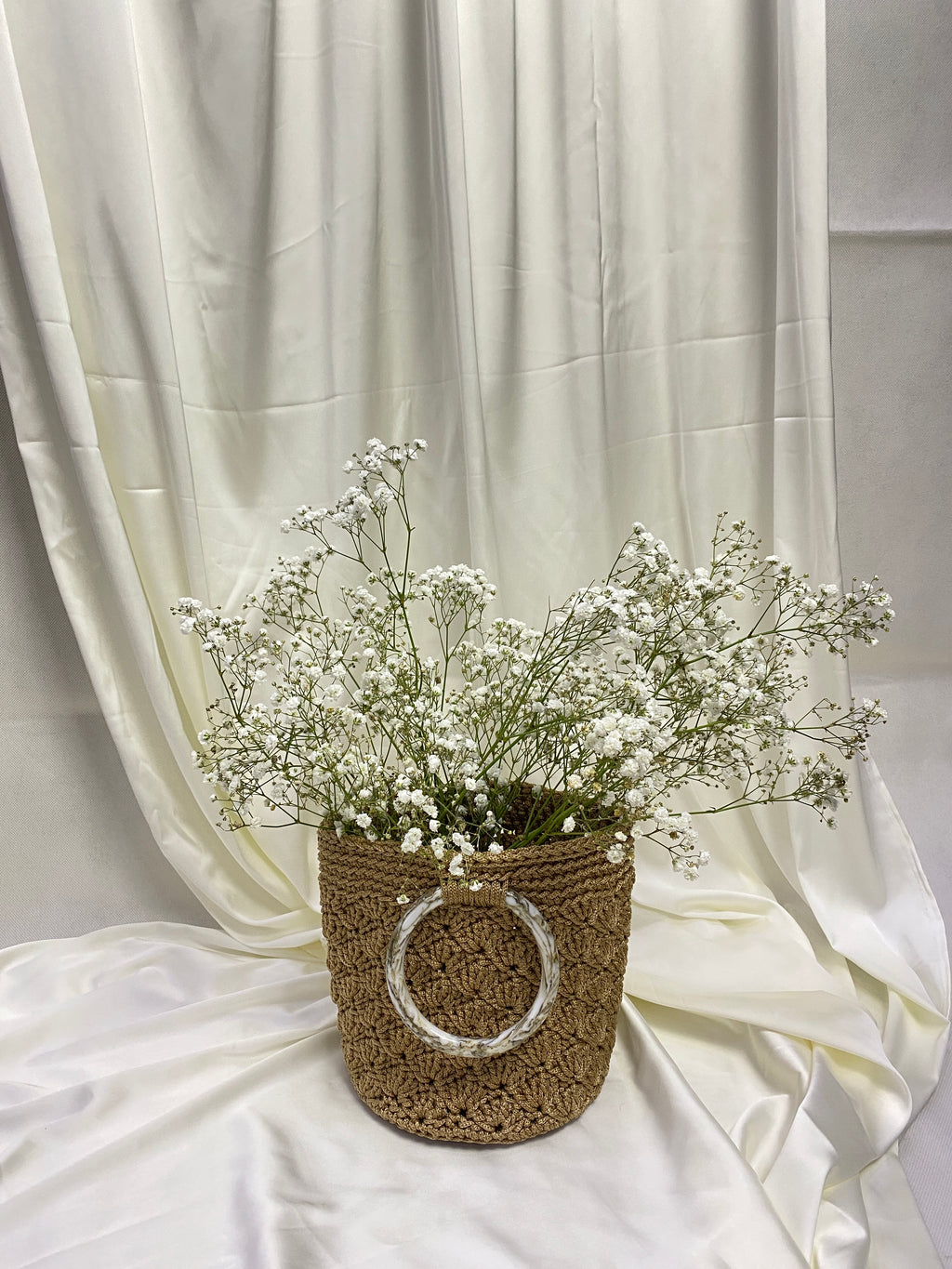 Handmade crochet bags and purses crafted in Singapore by Li Na Lay Nar. Mini Crochet Basket Bag with seashell weave design, perfect for everyday wear or as a statement piece.