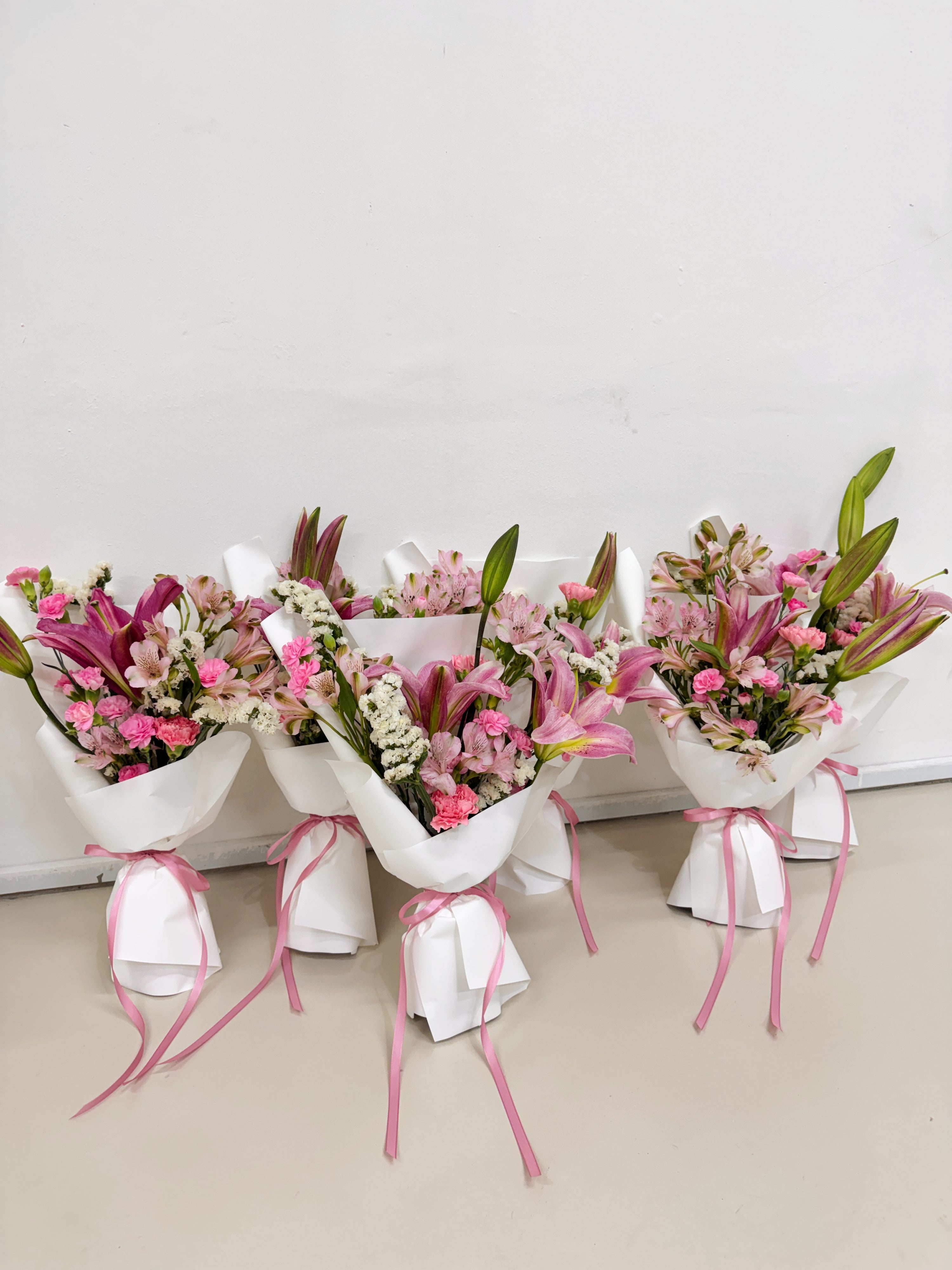 Mother's Day sweet pink lily and carnation bouquet to gift mothers for luxury brands client appreciation.