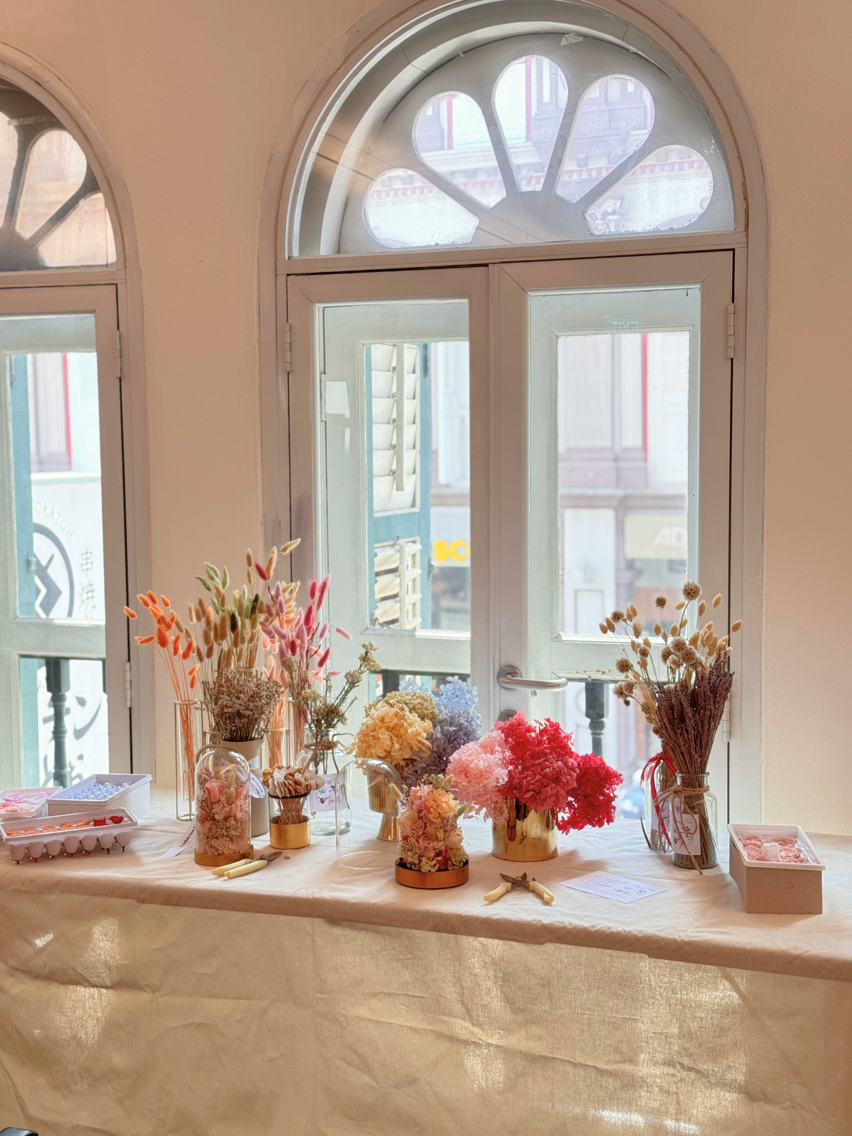 Celebrate Mother’s Day 2025 in Singapore with a pilates reformer workout by REIGN Pilates, followed by a lighted preserved flower dome arrangement workshop by Eden’s Ground.