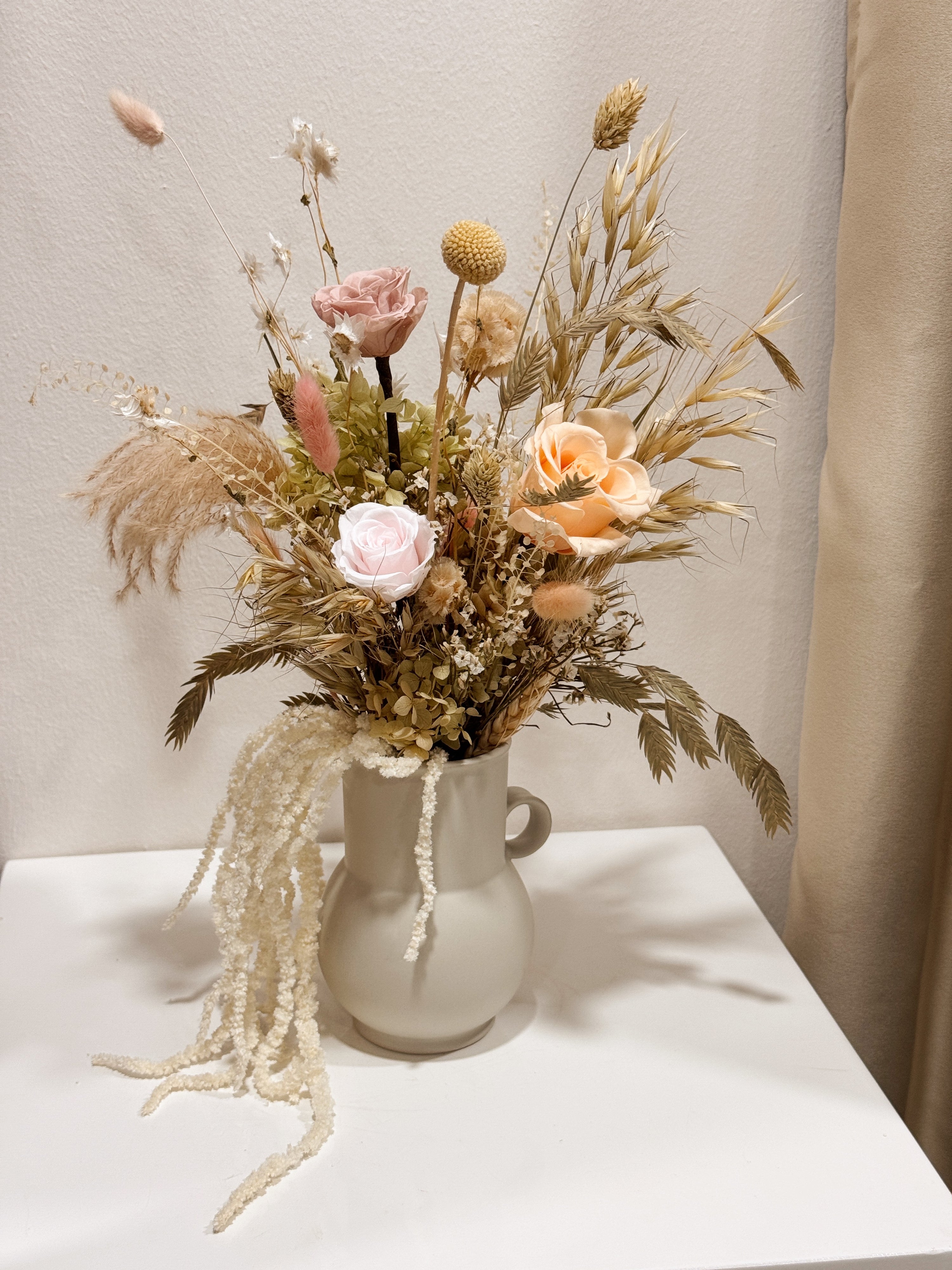 My Cup Runneth Over vase arrangement by Eden’s Ground featuring everlasting florals in soft, earthy tones, with amaranthus spilling over — thoughtfully styled in a mini jug vase. Low-maintenance and long-lasting, it's perfect as a housewarming gift or as a timeless piece of home décor.