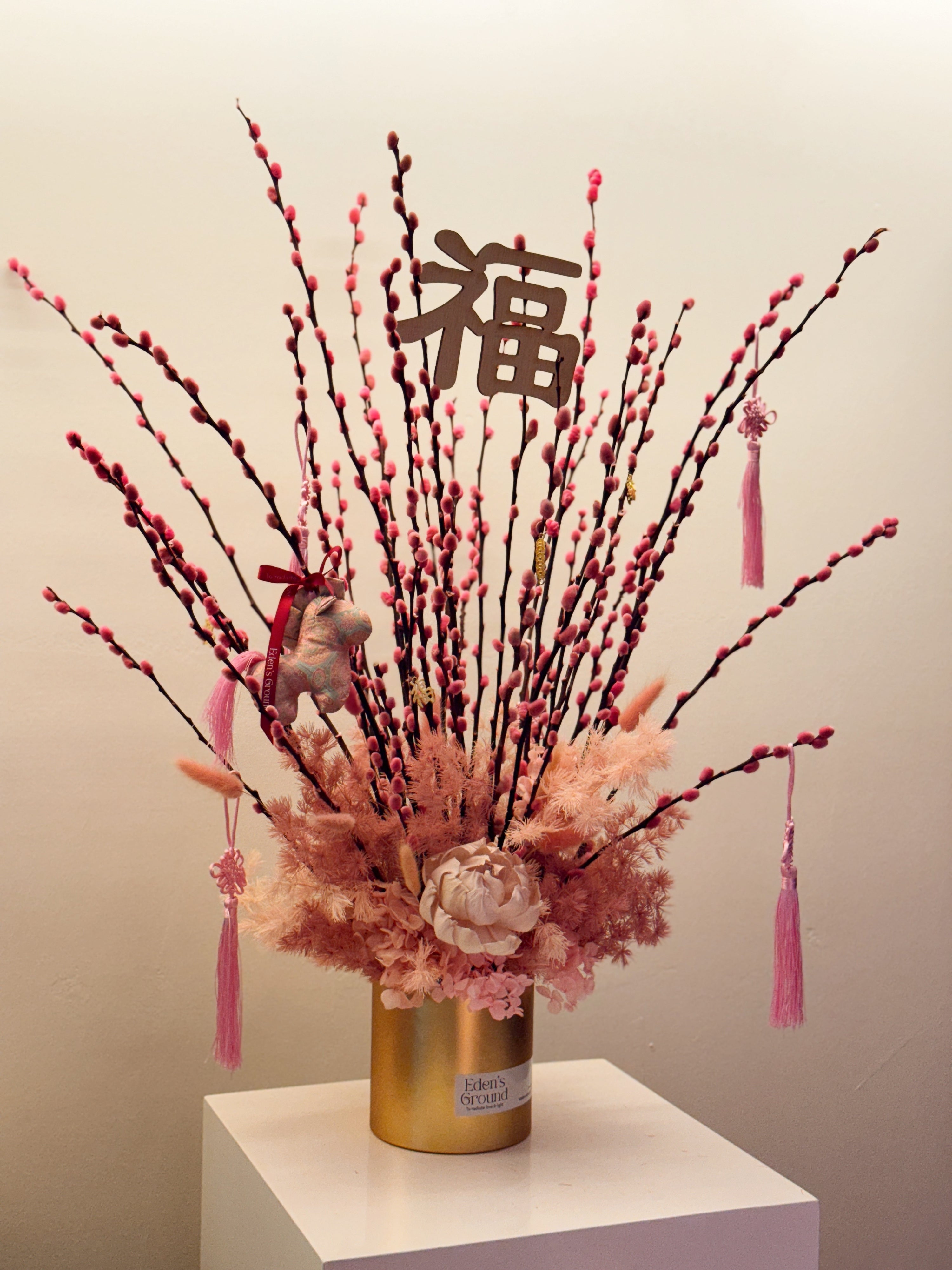 Chinese New Year 2026 Pussy Willow Flower Box, featuring pink and gold pussy willow cny flower, everlasting preserved hydrangeas, decorated with pink tassles and 福 to usher in wealth, abundance, prosperity and all the good vibes for the lunar new year, crafted by Eden's Ground, a floral design studio in Singapore. Delivered straight to your doorstep.