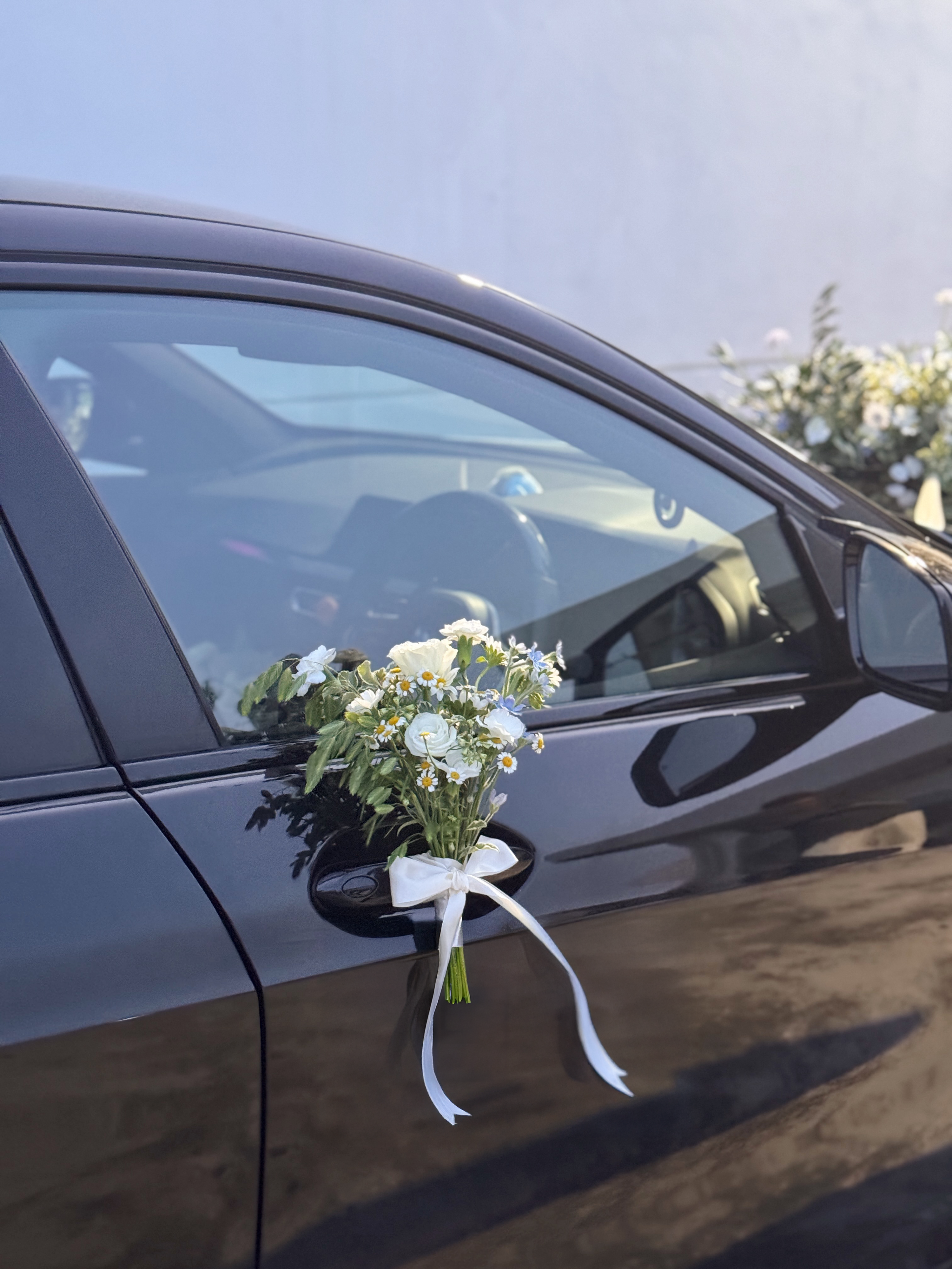 Wedding bridal car decor, craffted with fresh flowers by Eden's Ground, a floral design boutique.